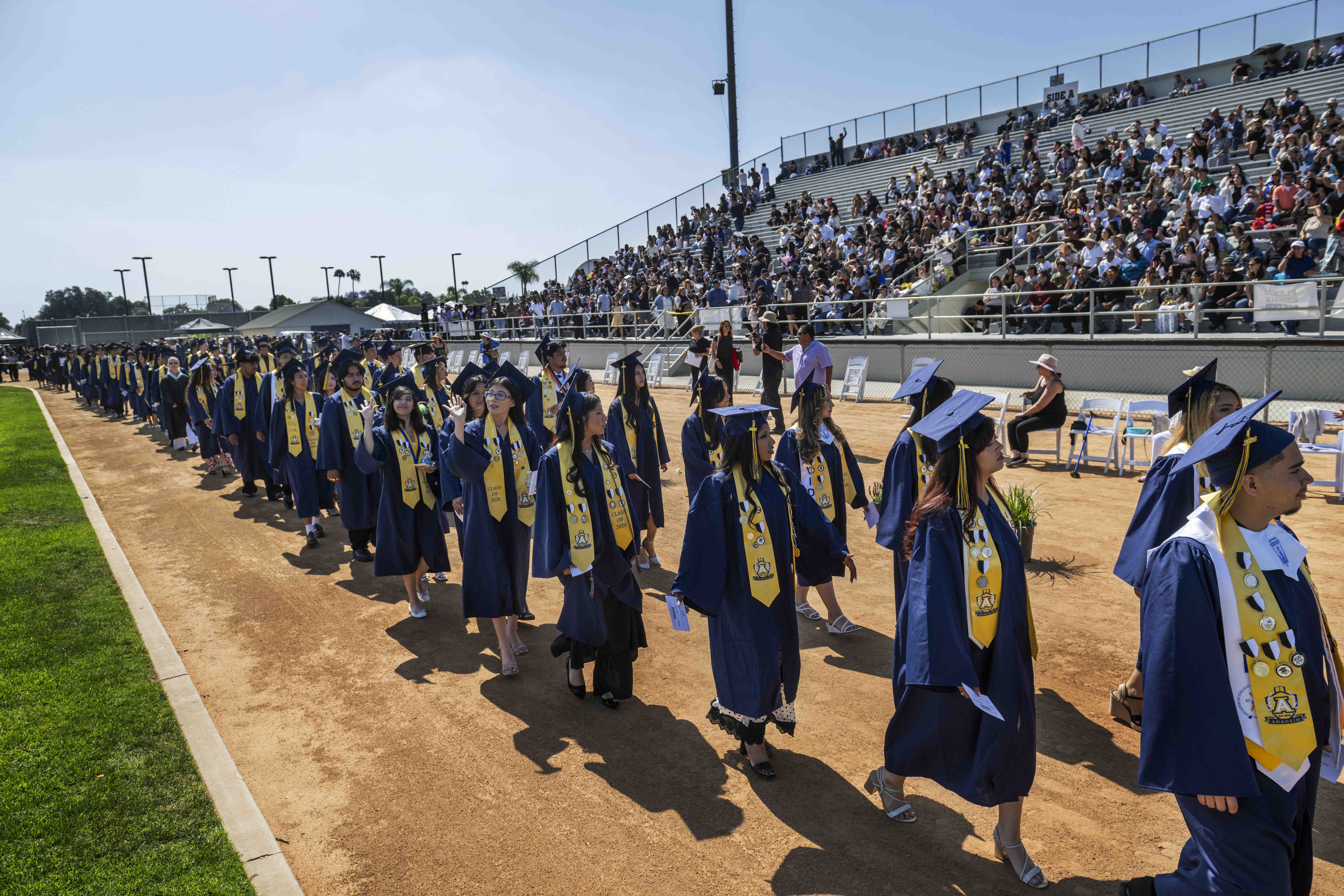 Graduates enter Handel Stadium during the Anaheim High School graduation...