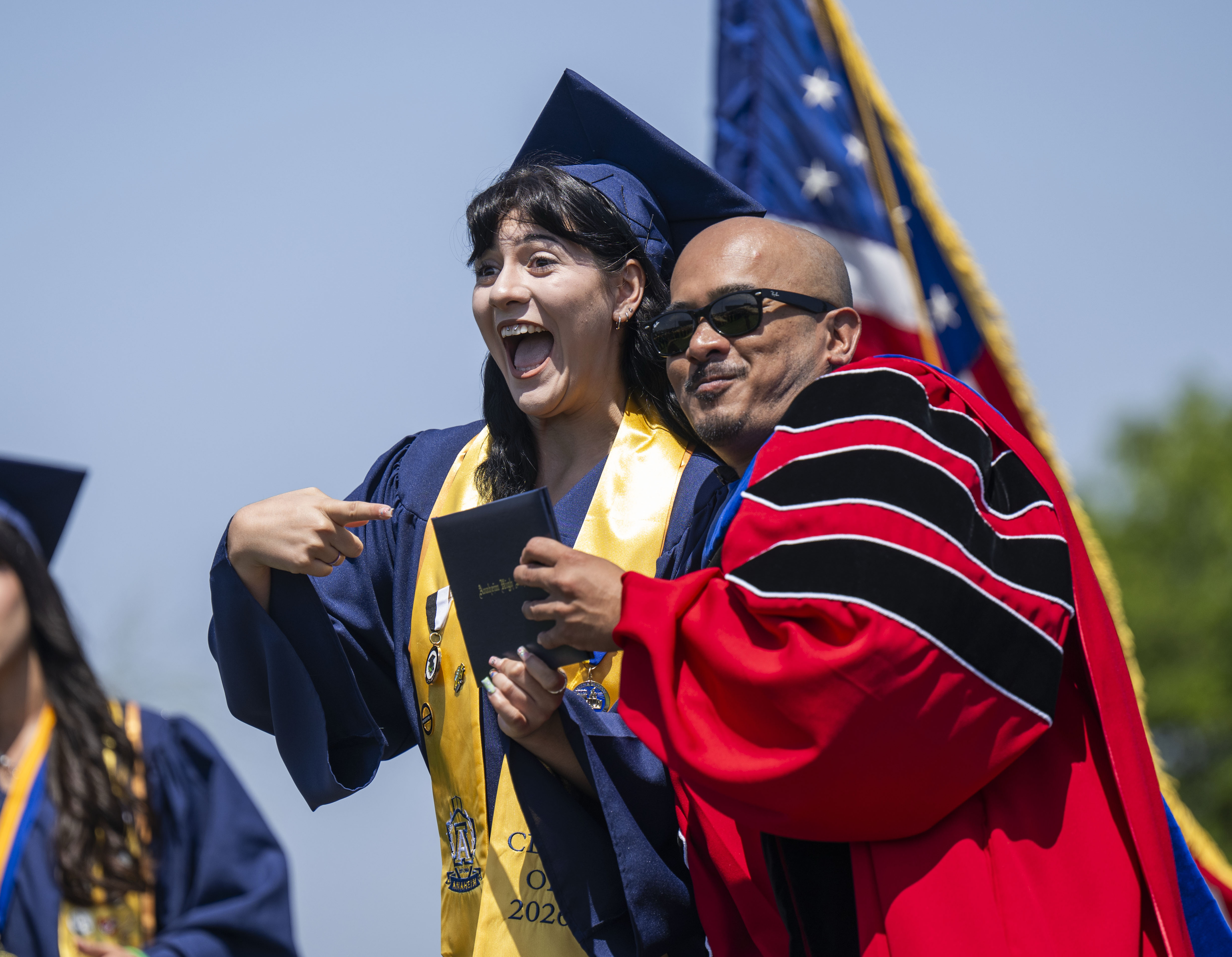 Shilah Escobosa, left, has some fun as she receives her...