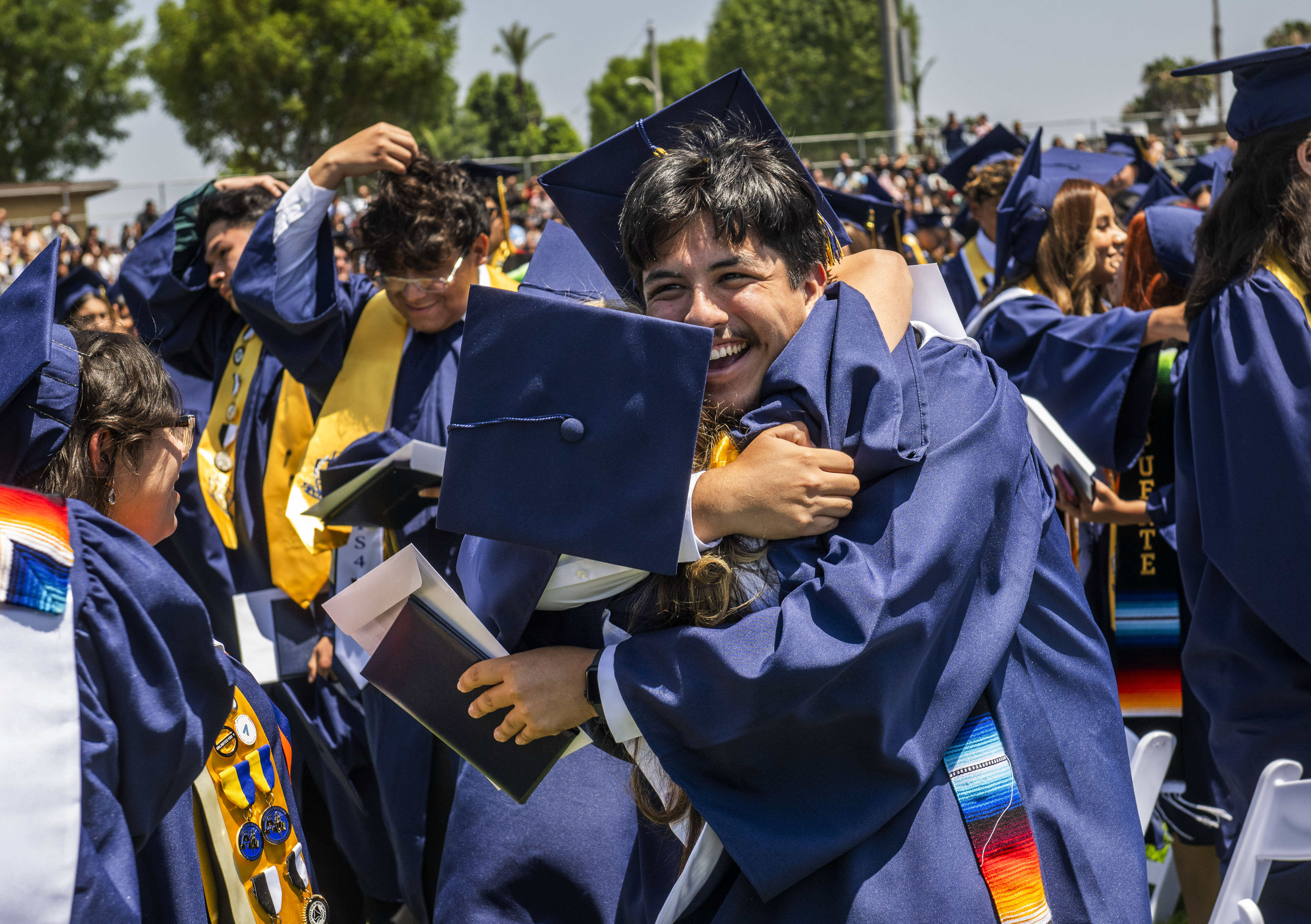 A graduate celebrates at end of the Anaheim High School...