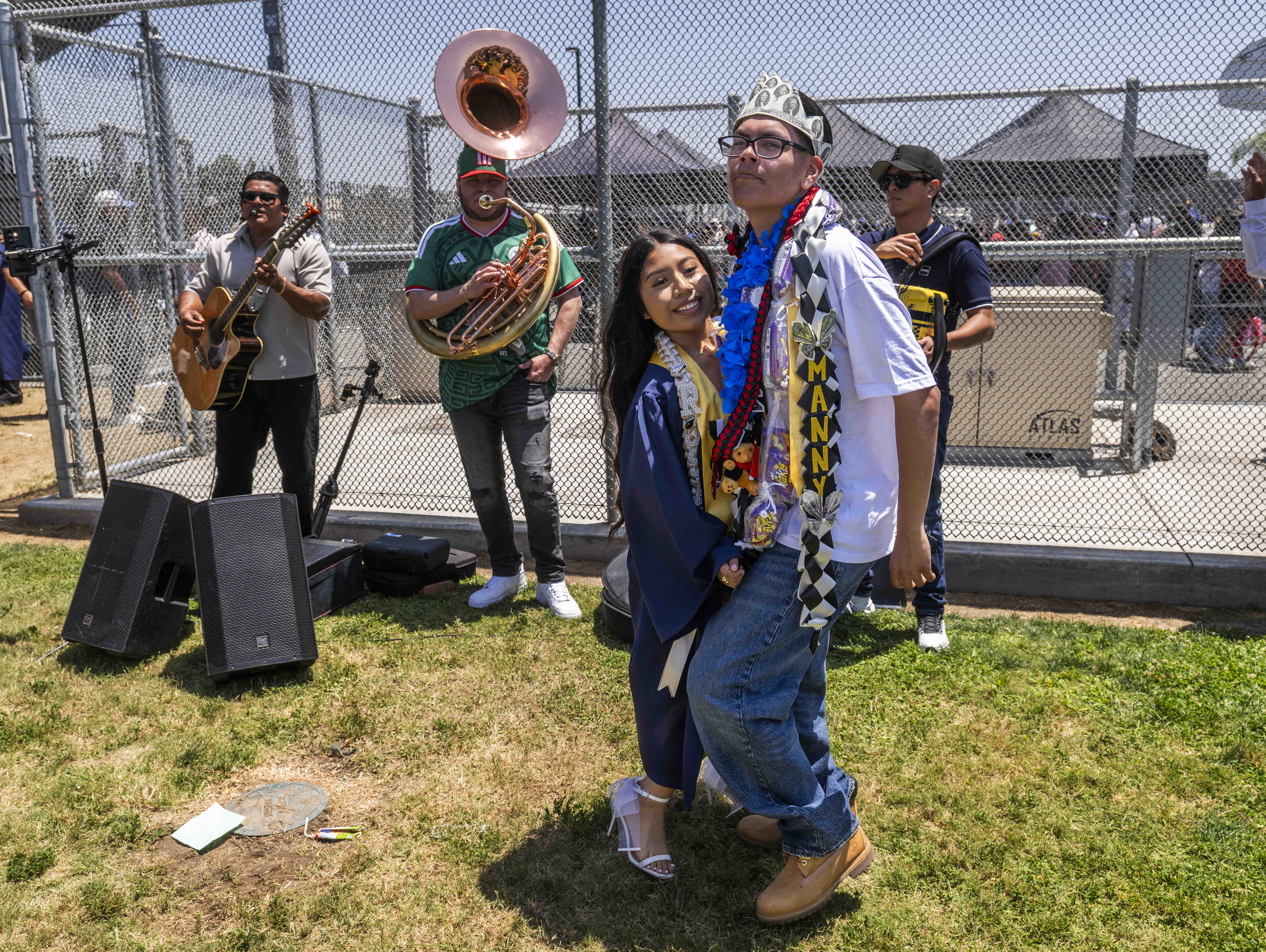 Graduate Britney Rosas and Manny Piñeda dance to the music...