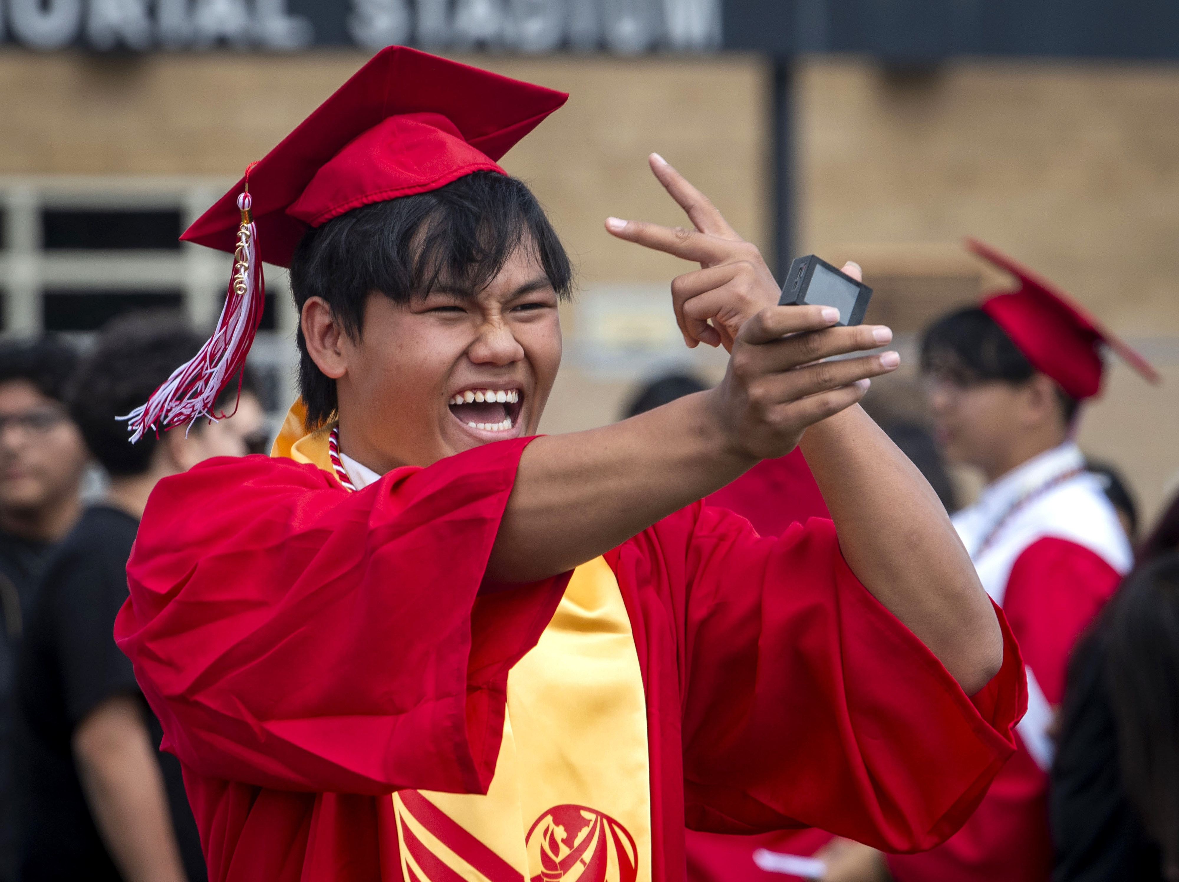 One graduate films himself during the Garden Grove High School...
