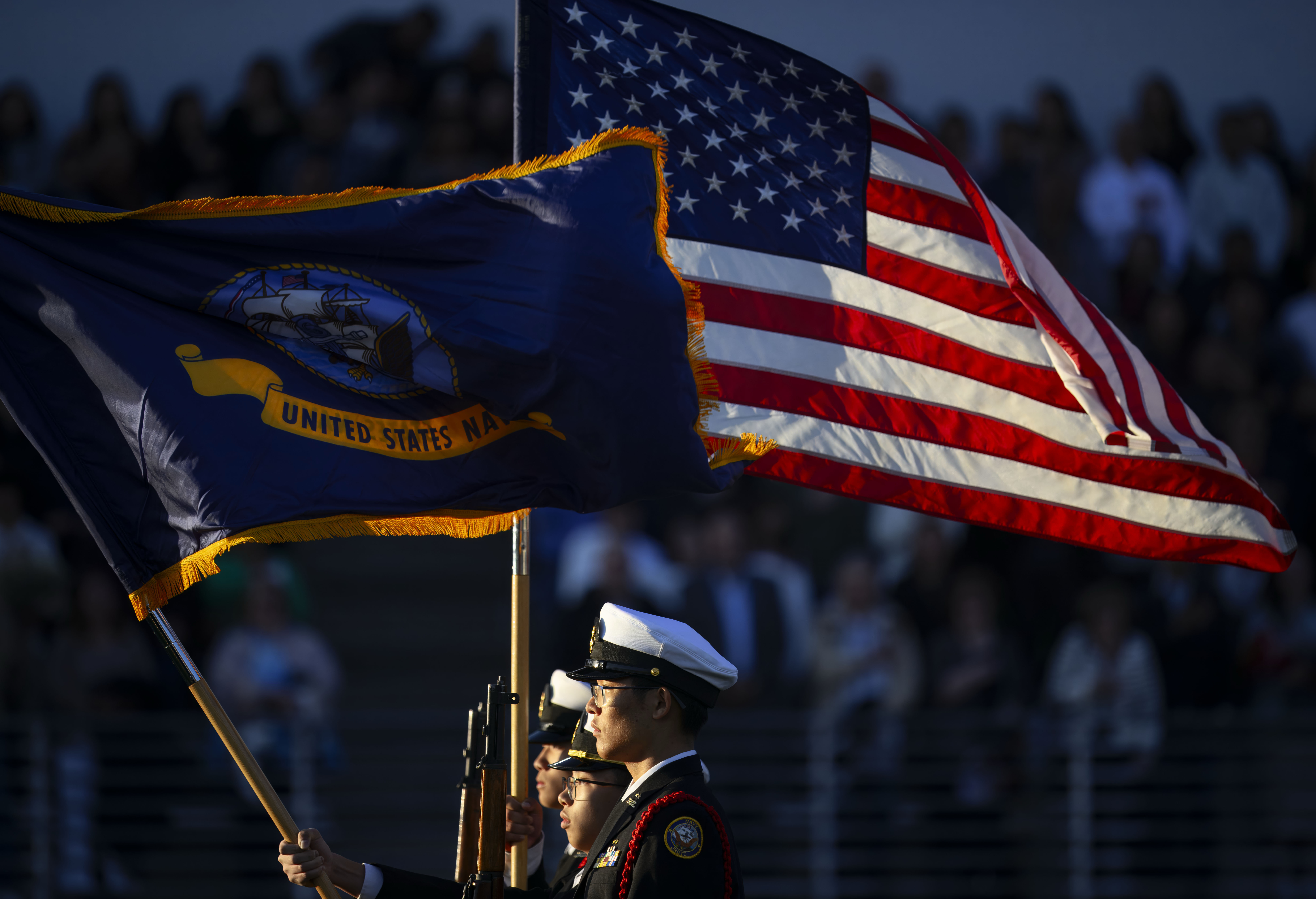 Troy Navy JROTC cadets present the colors for the playing...
