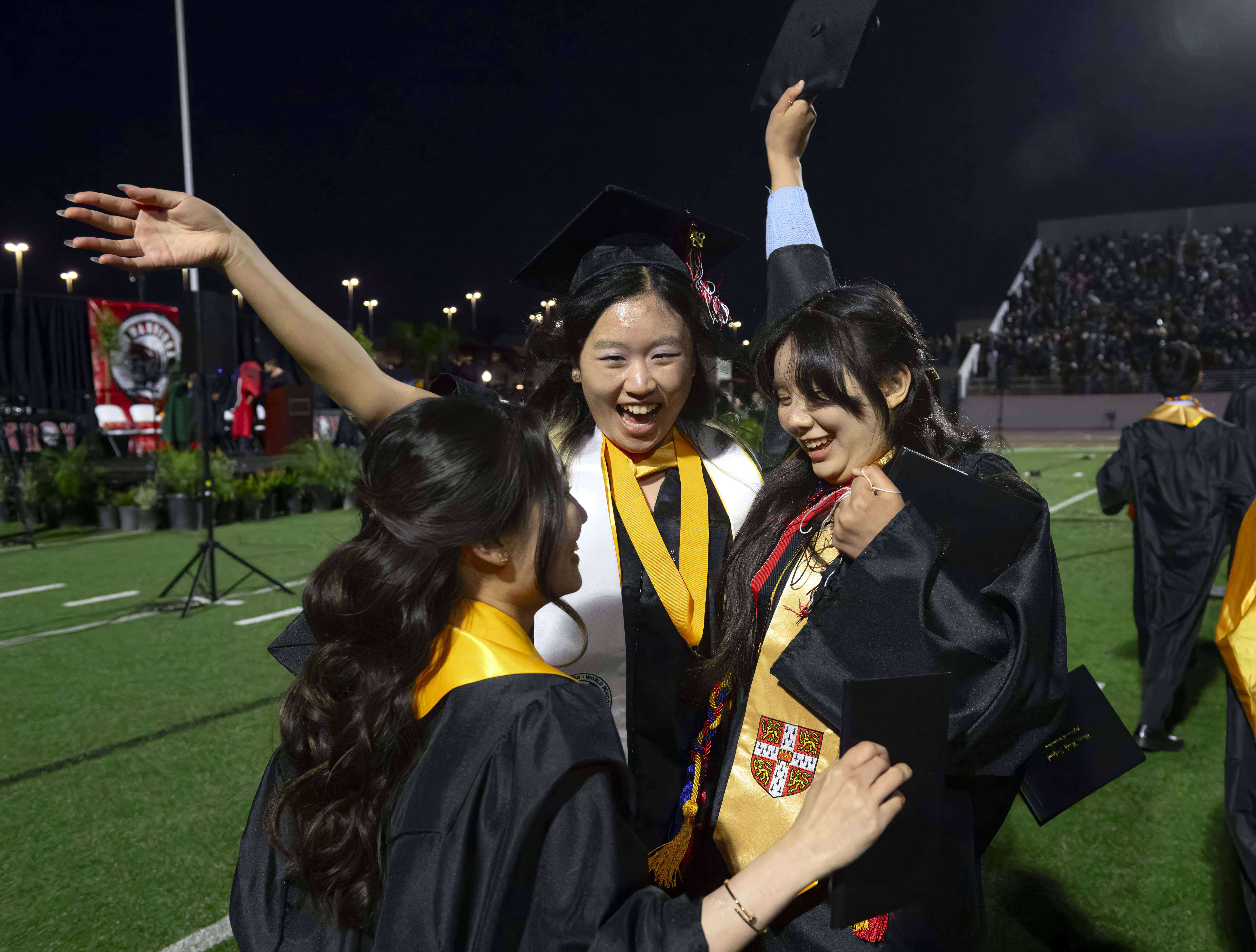 Graduates celebrate following the Troy High School graduation ceremony in...