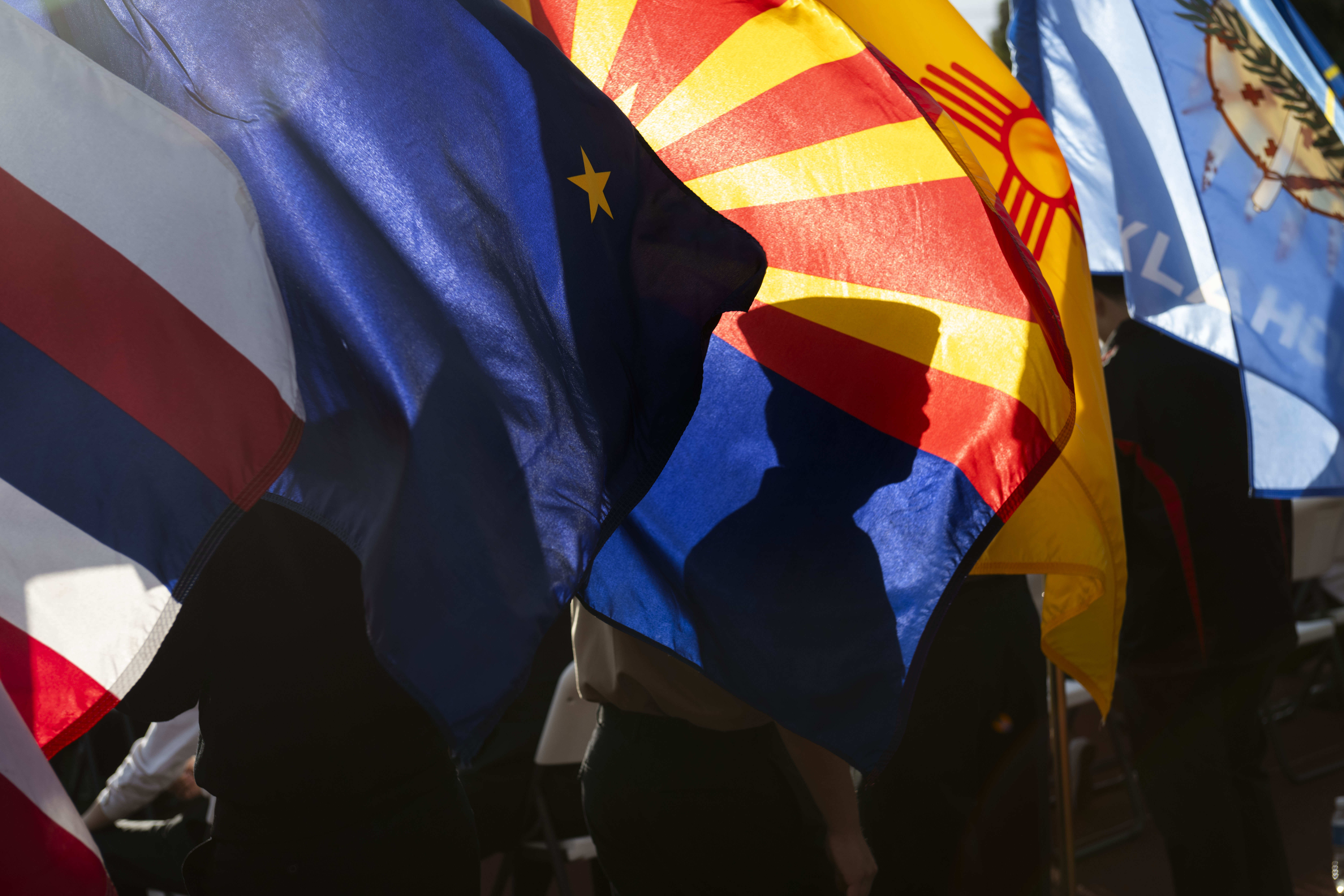State flags are displayed by Troy Navy JROTC cadets for...