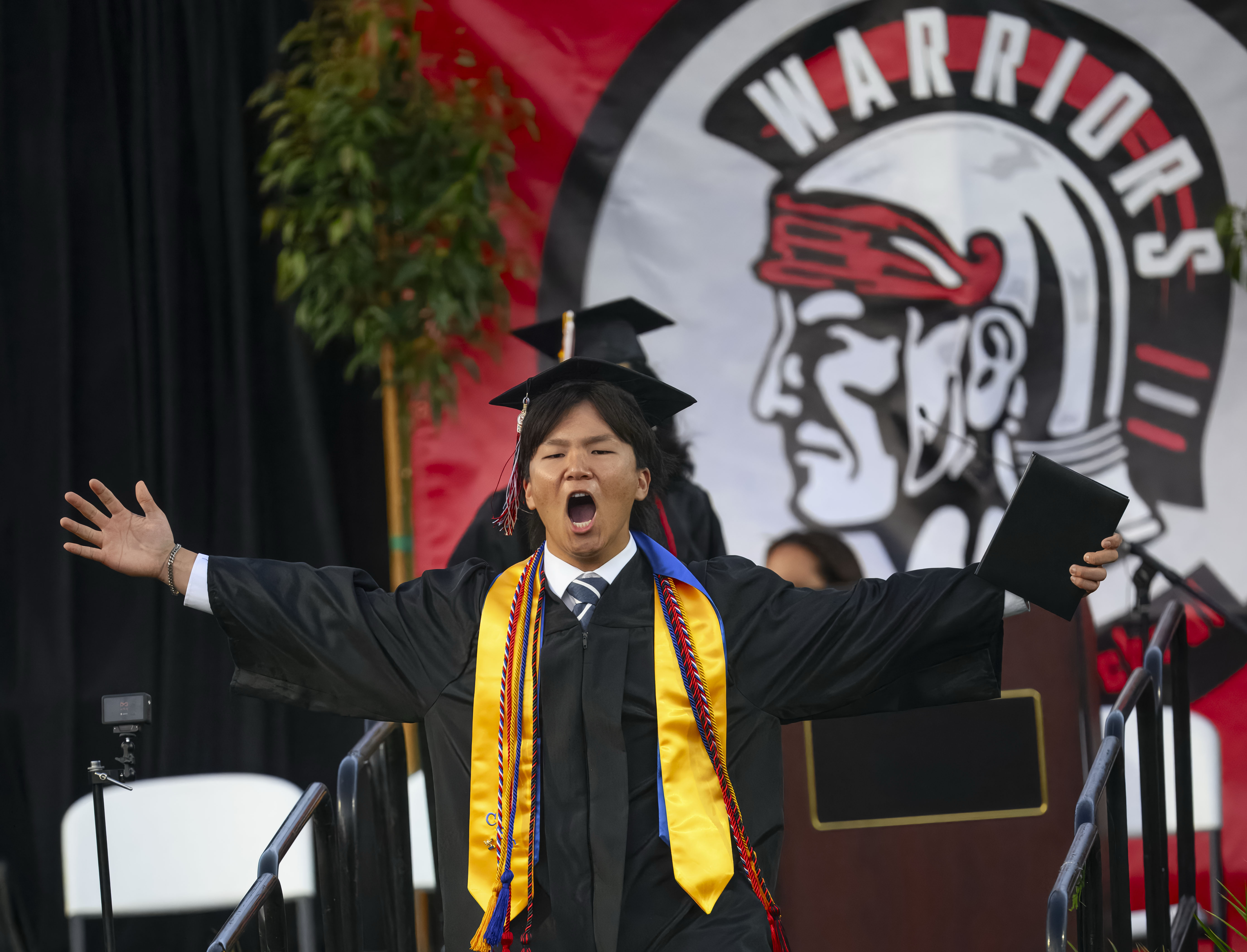 The celebration begins for a graduate after receiving his diploma...