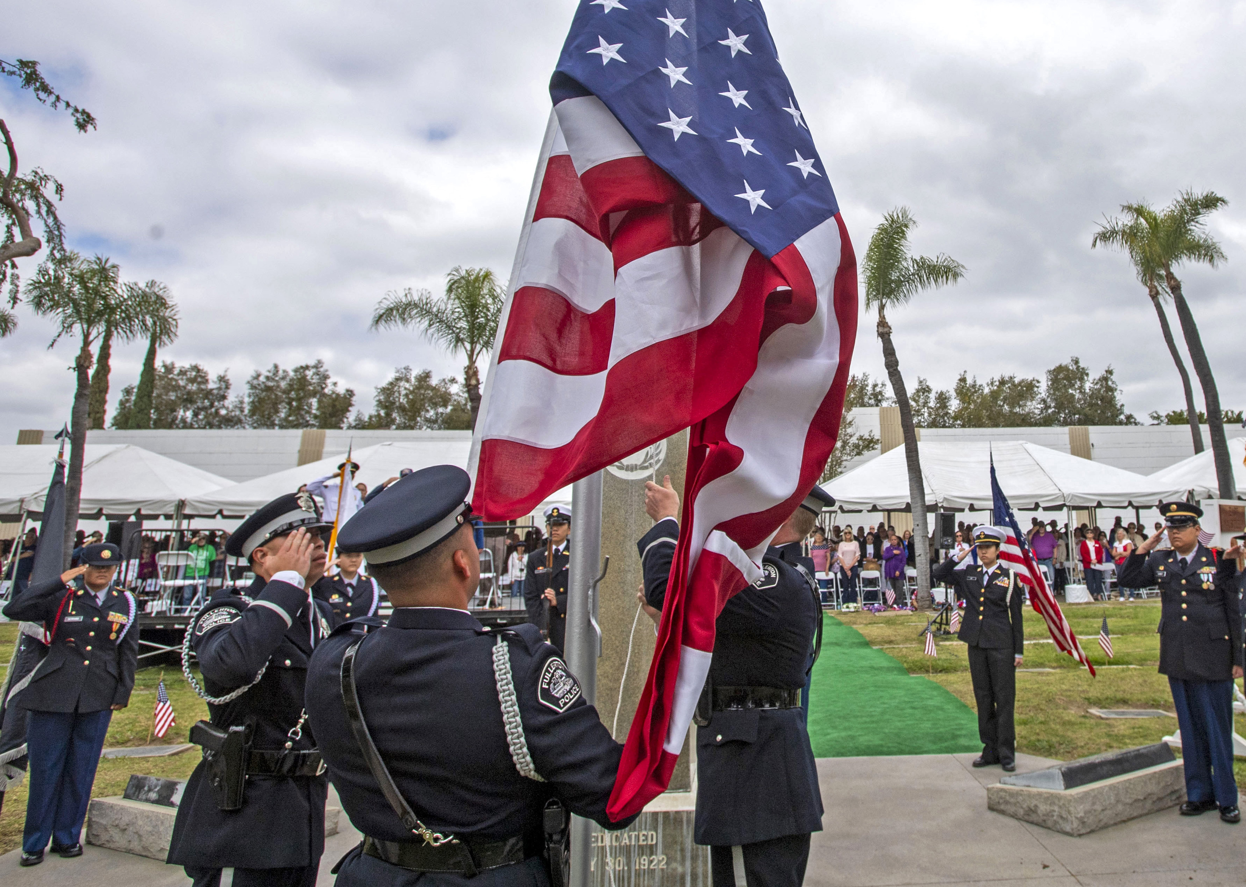 The Fullerton Police Departmentâs Honor Guard presents the colors during...