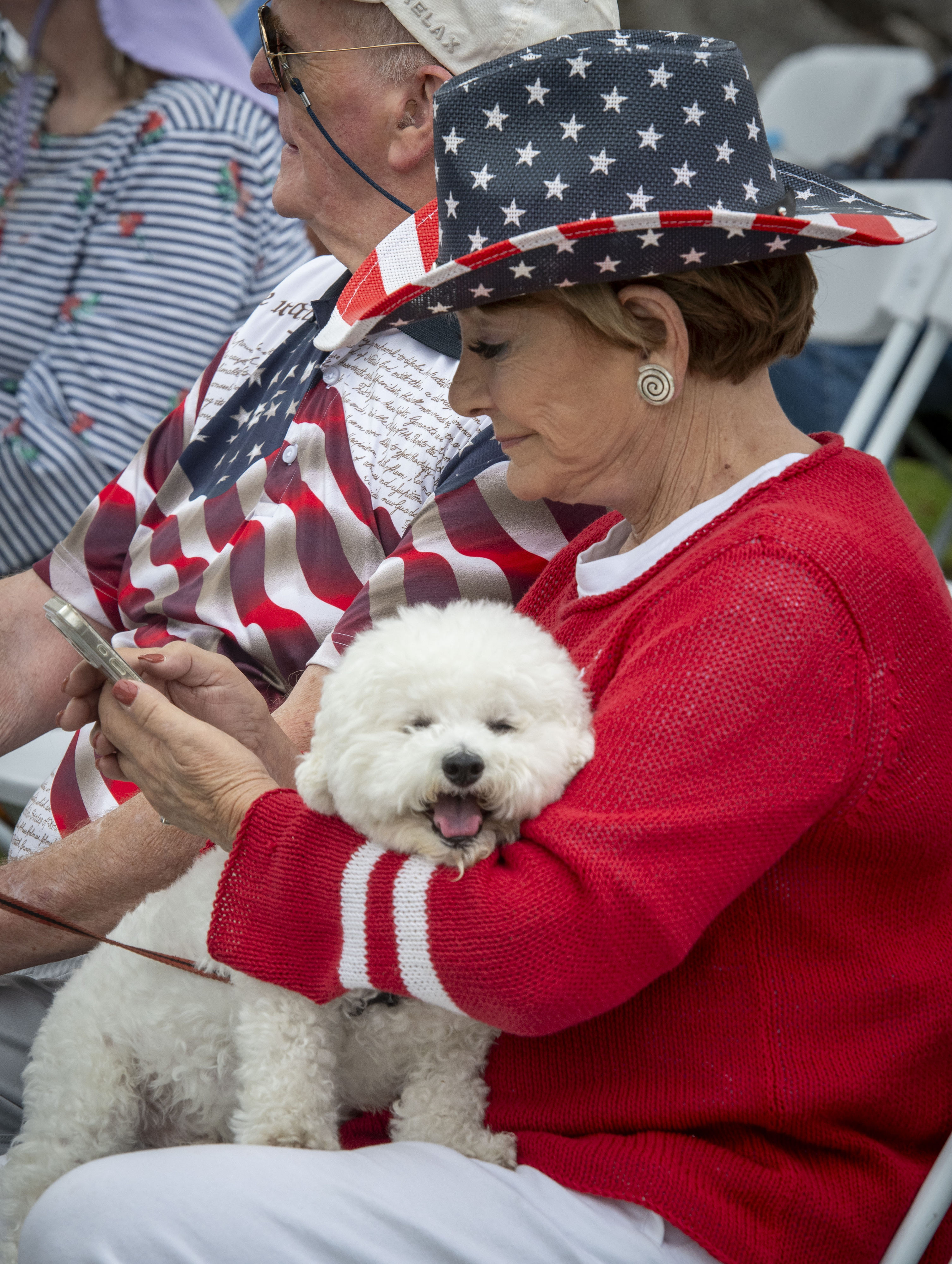 Candy Gleason with her dog Lucky during Memorial Day services...