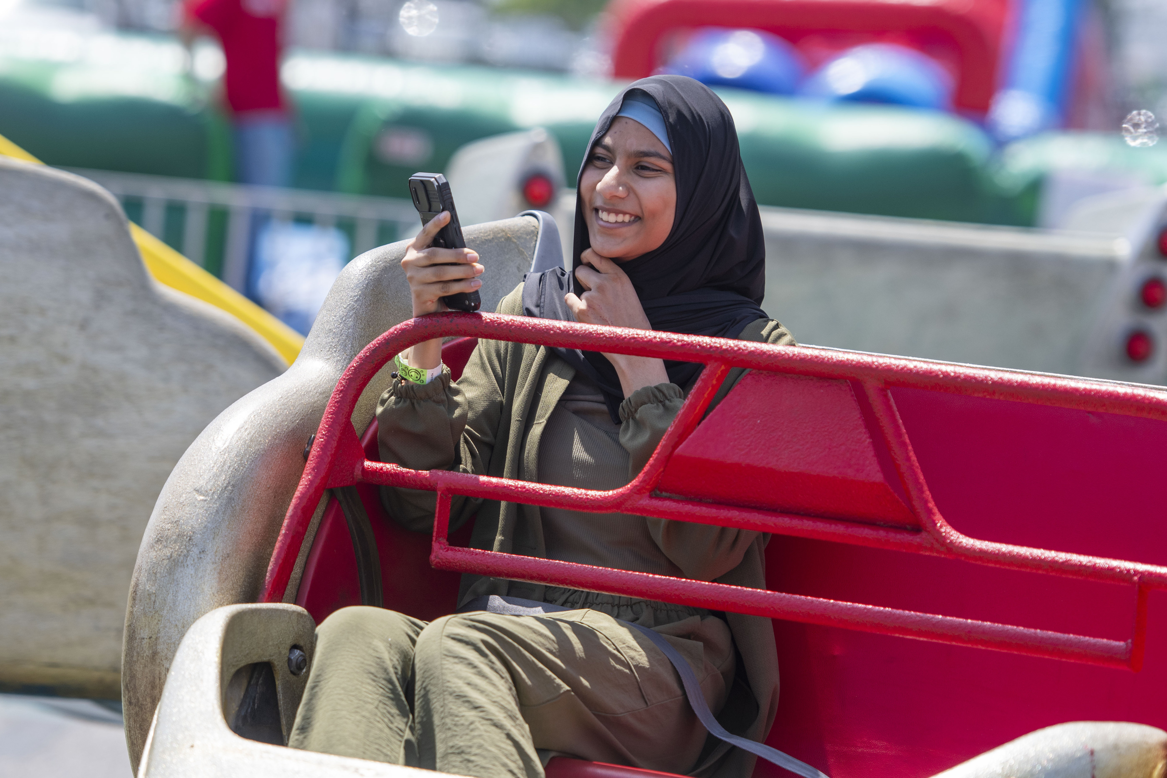Sadia Patel of Lawndale records her ridenduring the celebration of...