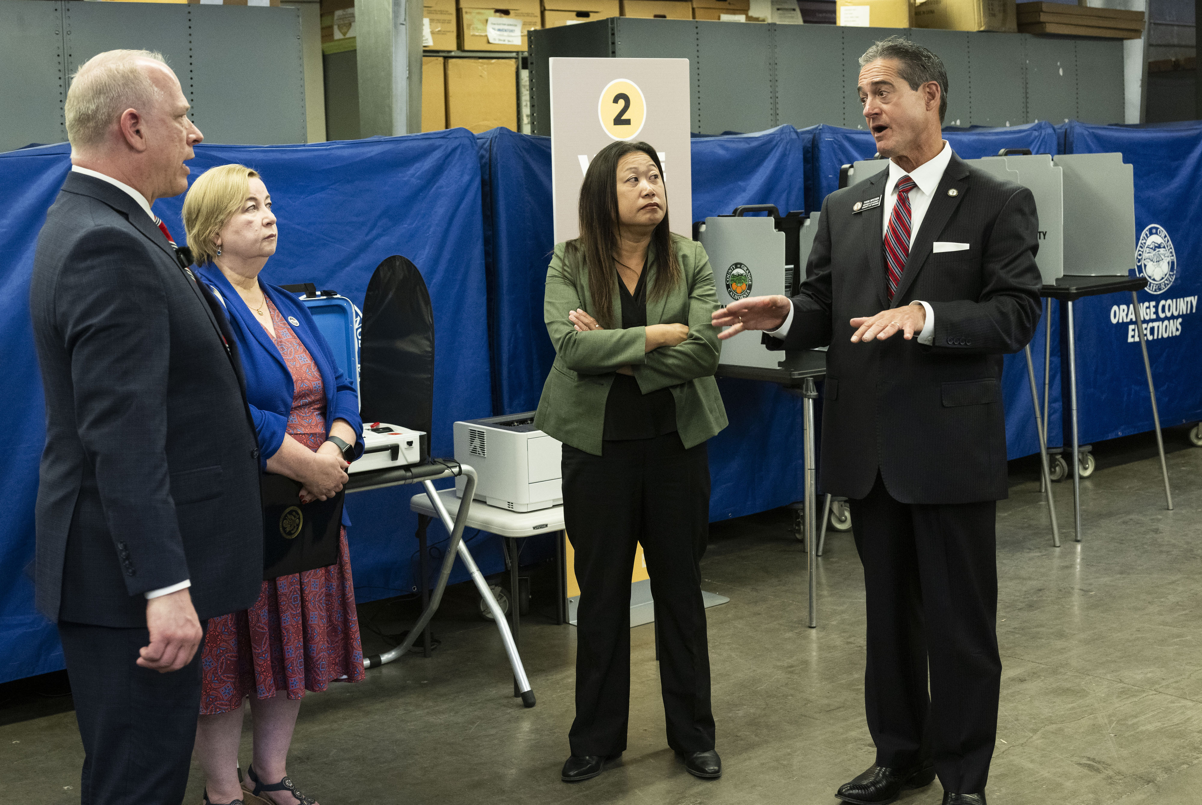 Orange County Registrar of Voters Bob Page, along with Christy...
