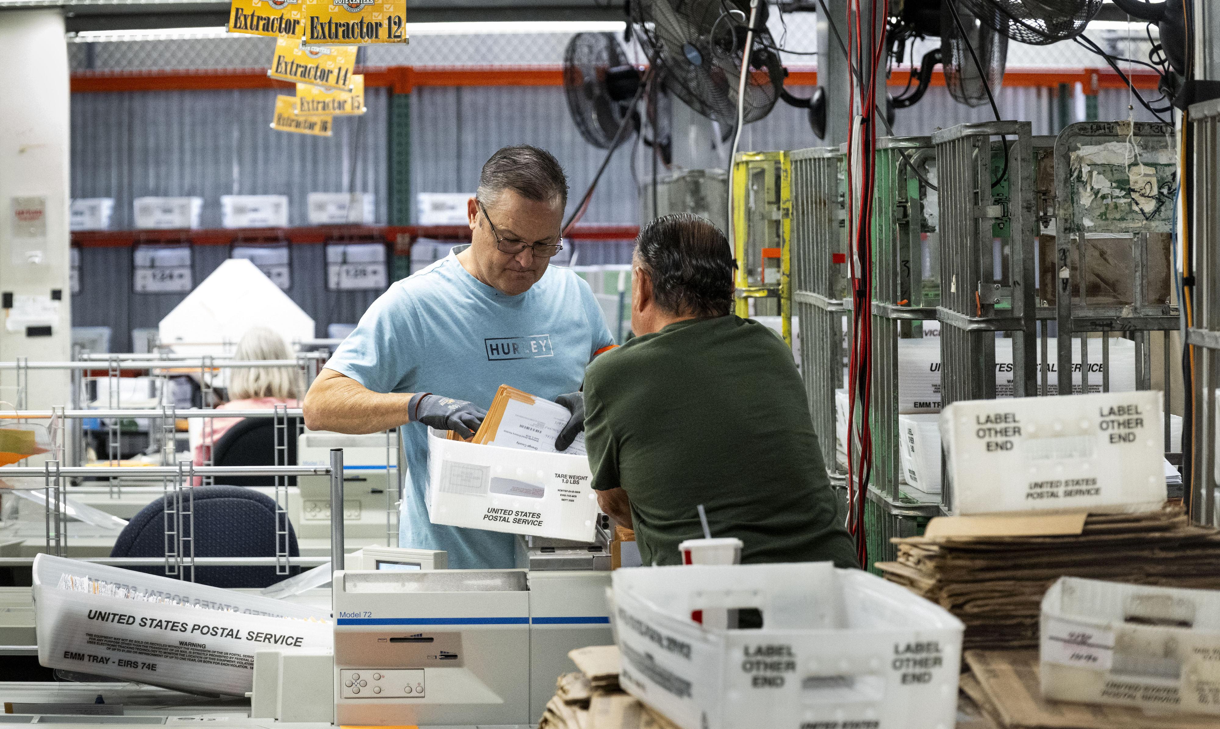 People work in sorting and extracting at the Orange County...