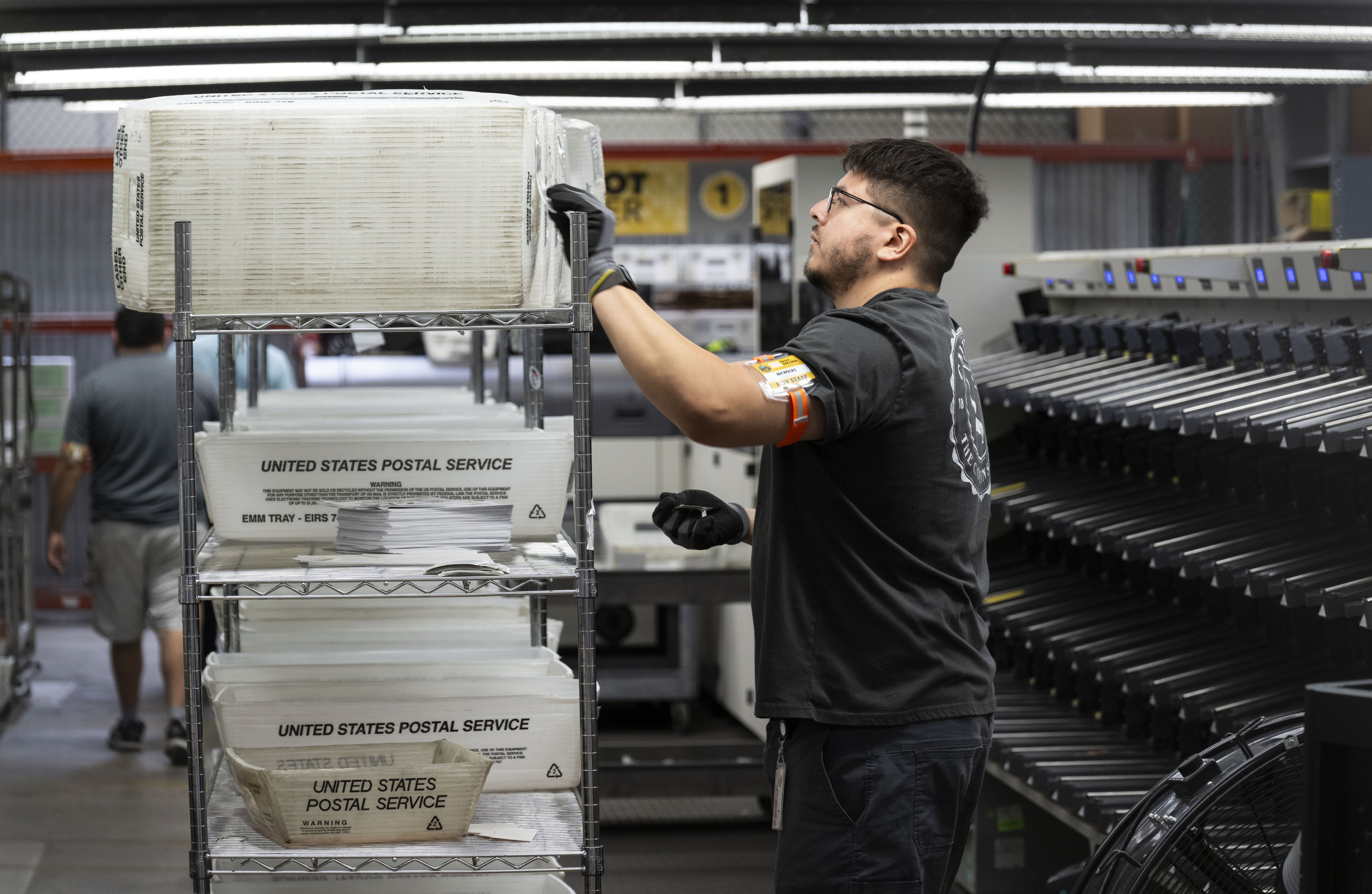 People work in sorting and extracting at the Orange County...
