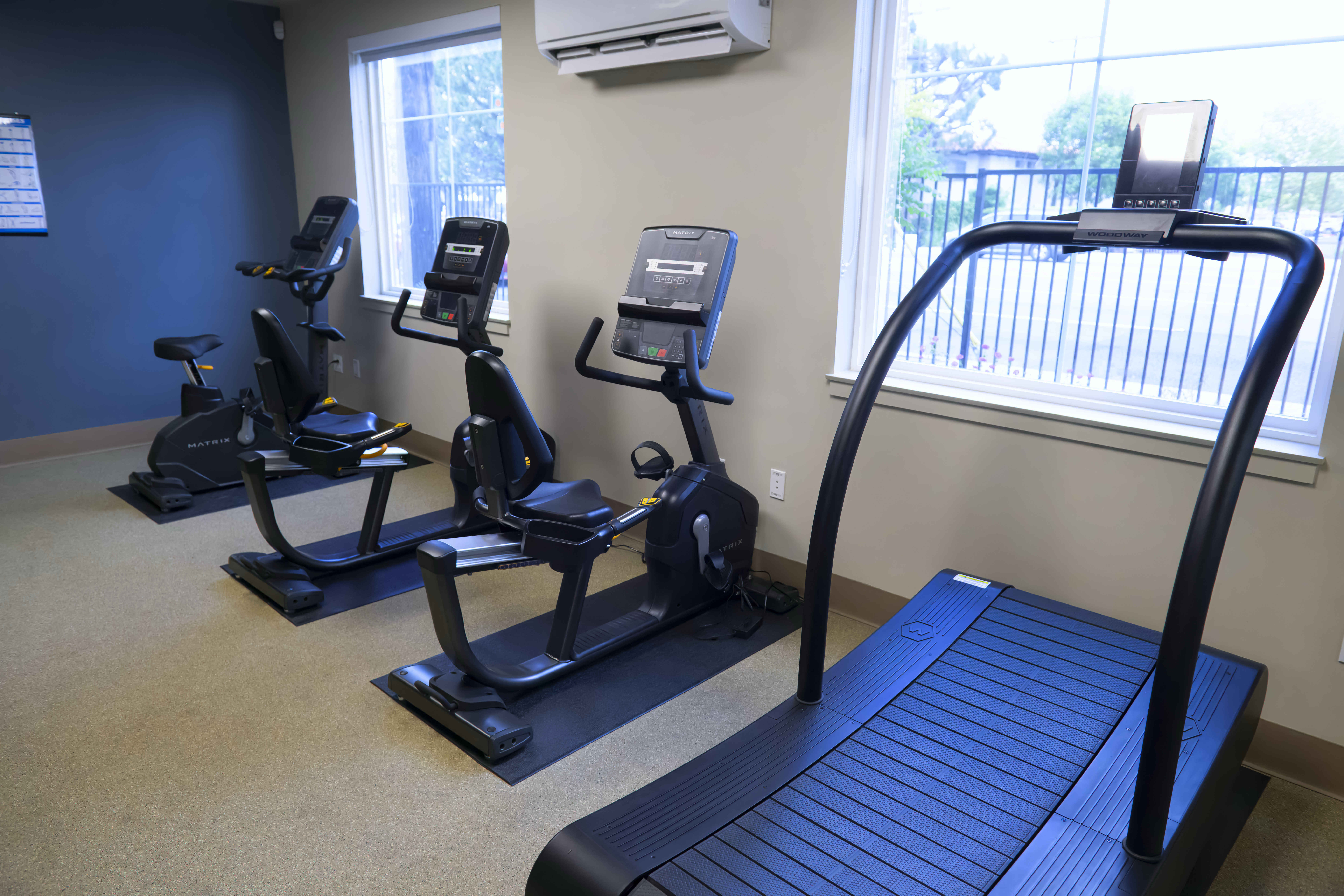 The fitness center at The Orion apartment community for seniors...