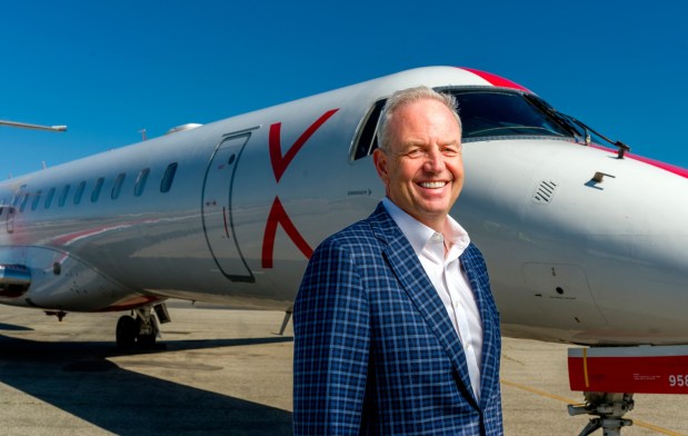 Alex Wilcox, CEO of JSX, on the tarmac, is pictured with one of the airline's Embraer passenger jets at John Wayne Airport in Costa Mesa on Thursday, April 23, 2026. (Photo by Leonard Ortiz, Orange County Register/SCNG)