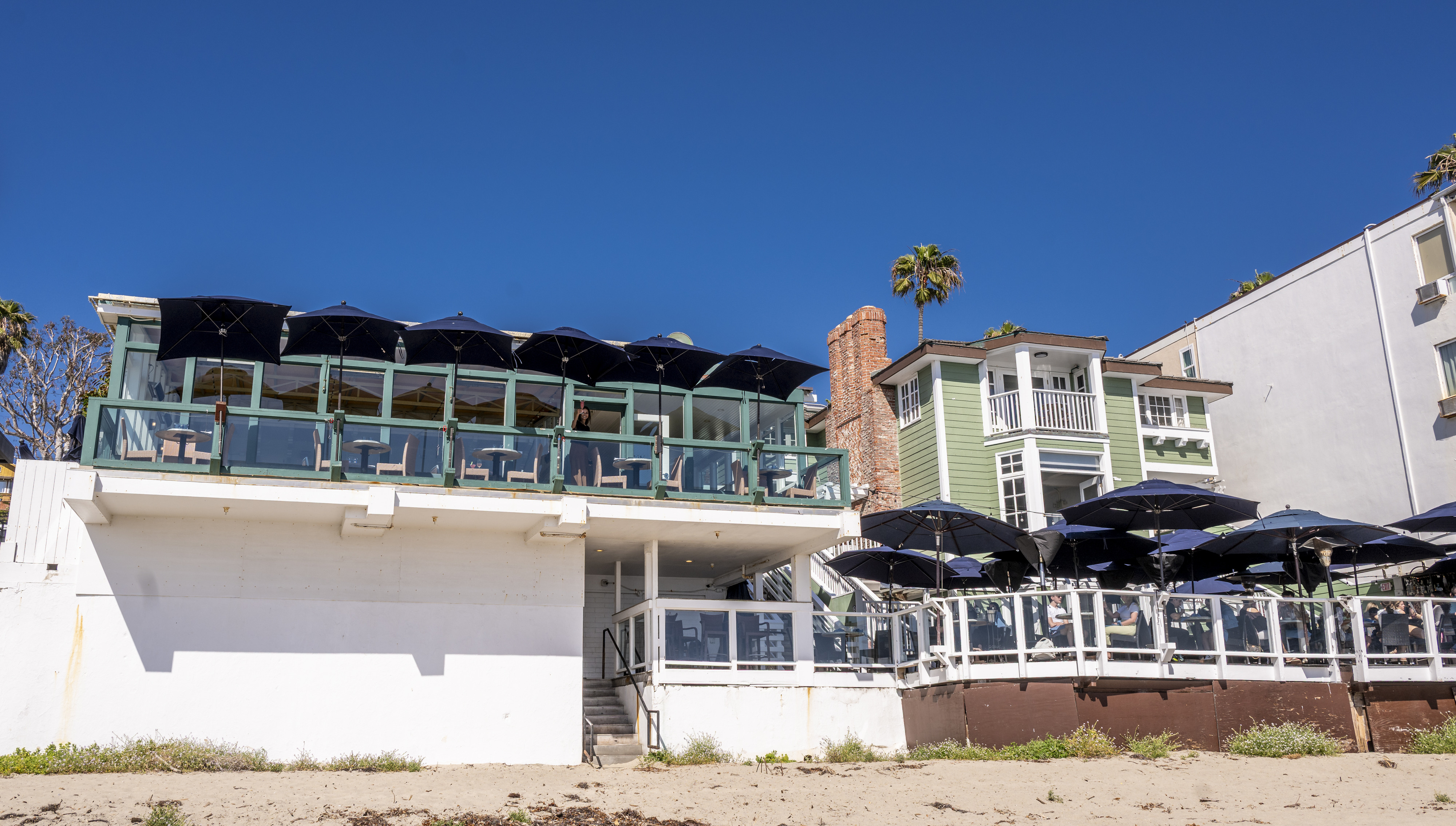 The Driftwood Kitchen, left, and its companion bar, The Deck,...