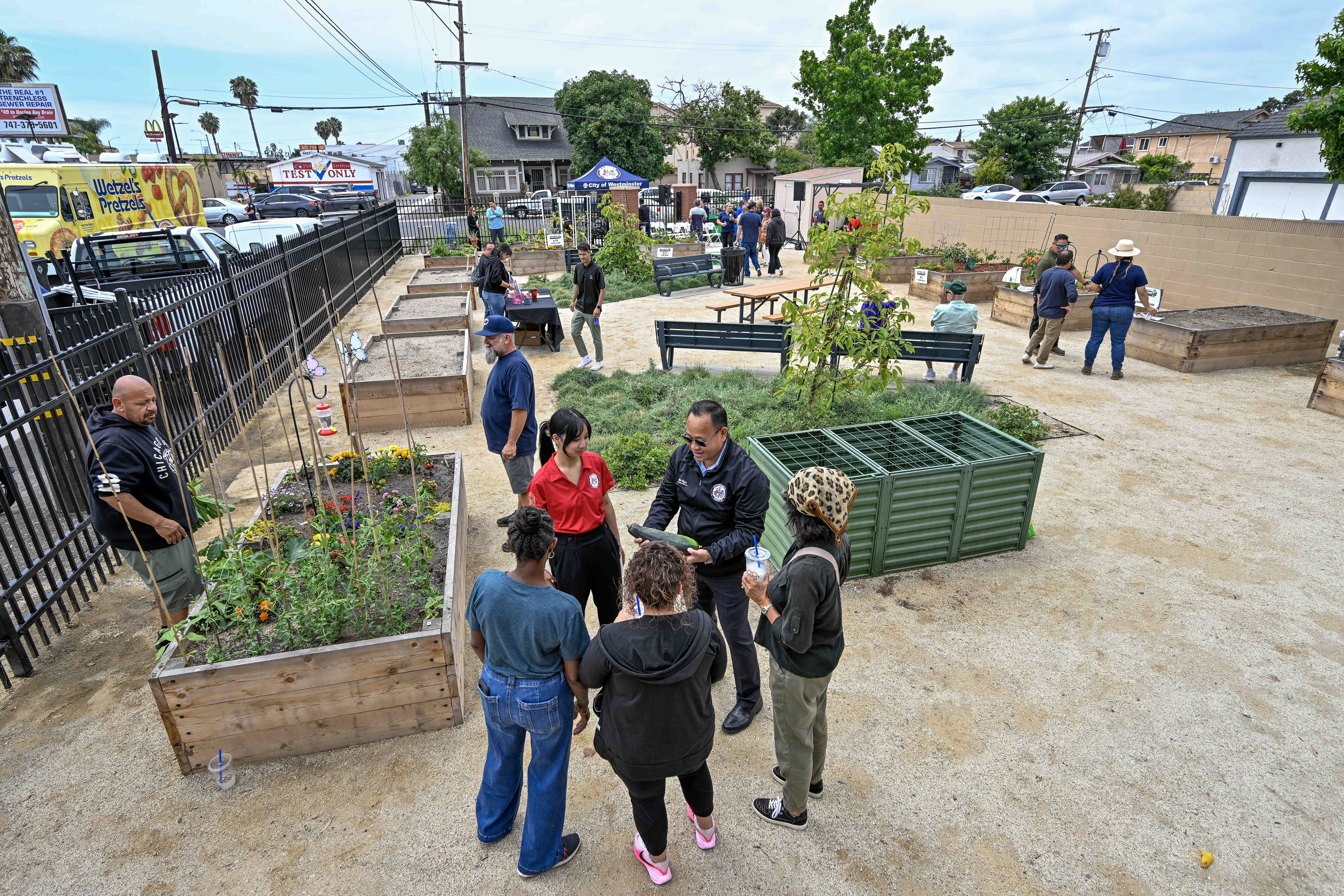 Members of the community and city officials check out the...