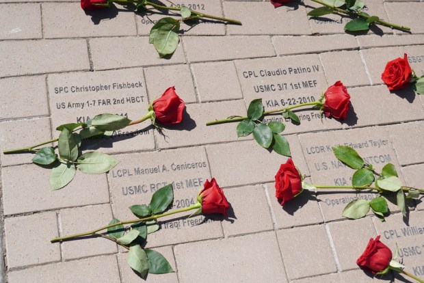 Roses were placed on the names of fallen service members from Orange County during the Memorial Day ceremony in Yorba LInda.Photographed on Monday May 30, 2022. (Photo by Michael Kitada, Contributing Photographer).