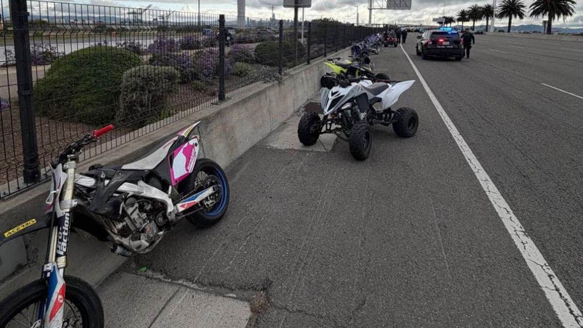 bike and ATV seen along side of bridge
