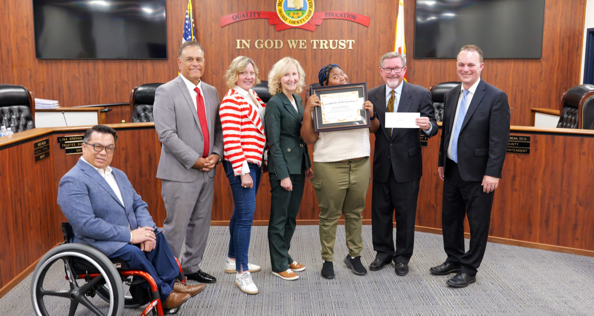 Cadet Foreman accepts his award alongside members of the Orange County Board of Education, Superintendent Dr. Stefan Bean, and his teacher, Elizabeth Wilson.