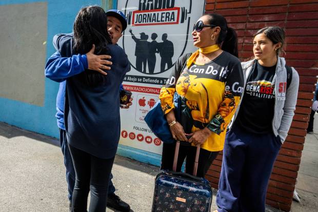 Outside the Pasadena Job Center Juan Ruiz says goodbye to his wife Esther and daughters Naomi, 14, and Monahmi, 13, before they depart of a charter bus with other Eaton fire survivors to Sacramento to demand a rescue plan for Altadena and Pasadena's recovery on Monday, May 18, 2026. (Photo by Sarah Reingewirtz, Los Angeles Daily News/SCNG)