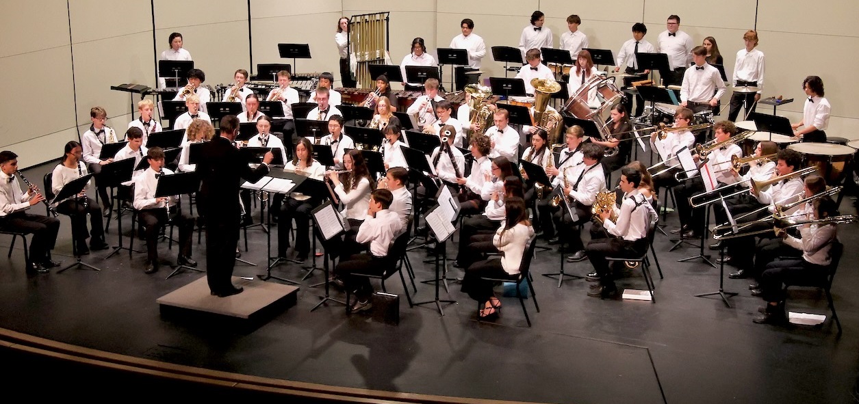 Poway High Music Instructor Mike Cook is shown conducting the...