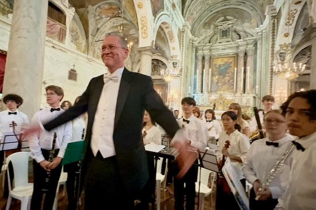 Mike Cook and instrumental music students performed in the Church...
