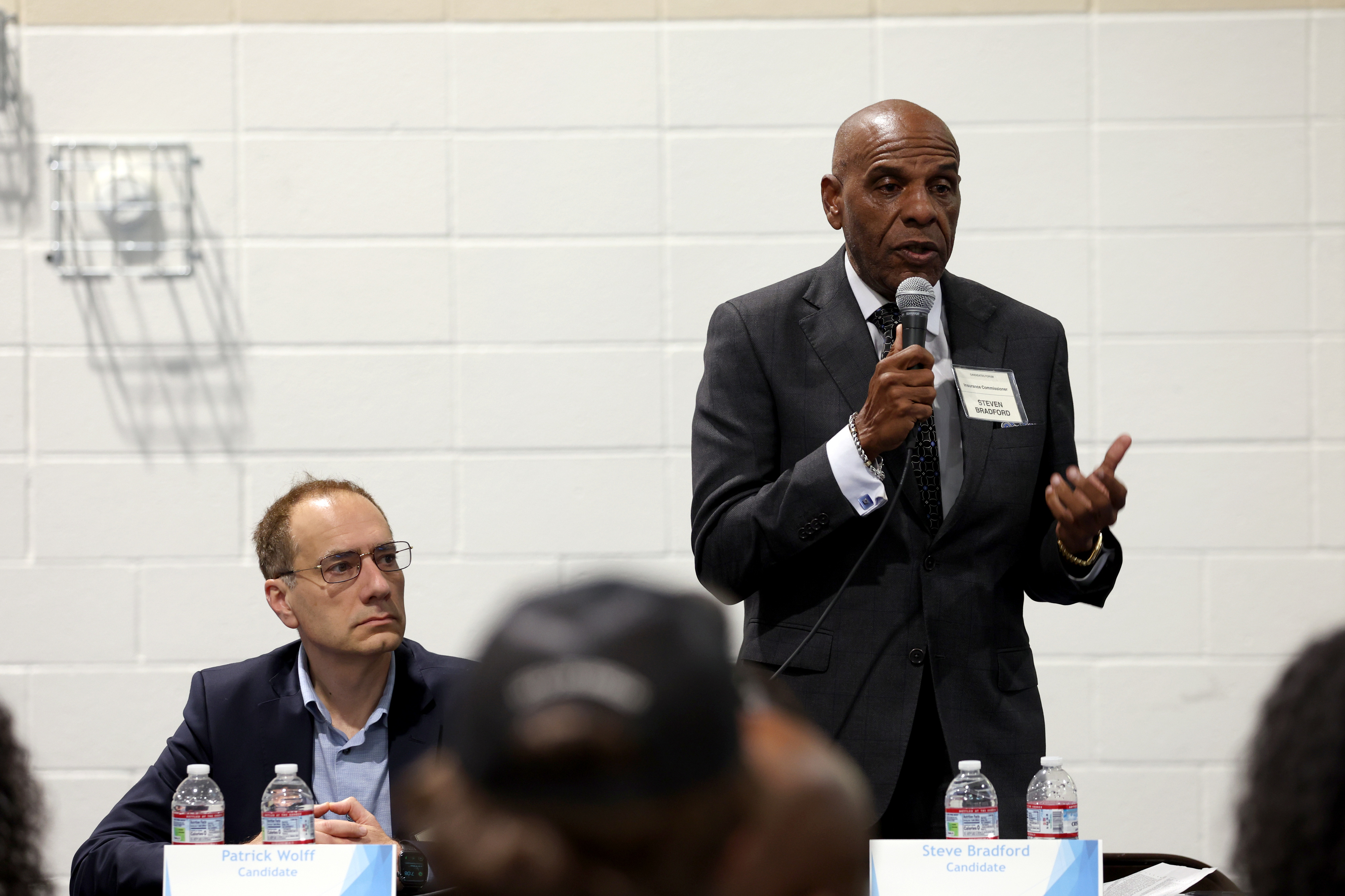 California Insurance Commissioner candidate Steve Bradford, right, speaks alongside fellow...