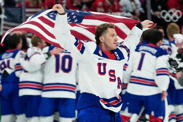 FILE - United States' Matthew Tkachuk (19) celebrates after the United States defeated Canada in a men's ice hockey gold medal game between Canada and the United States at the 2026 Winter Olympics, in Milan, Italy, Feb. 22, 2026. (AP Photo/Petr David Josek, File)