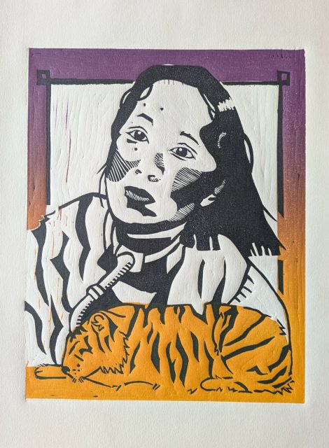 A linocut print of a woman with shoulder-length hair looking upward, with an orange-striped cat lying in front of her. The background is purple and orange.