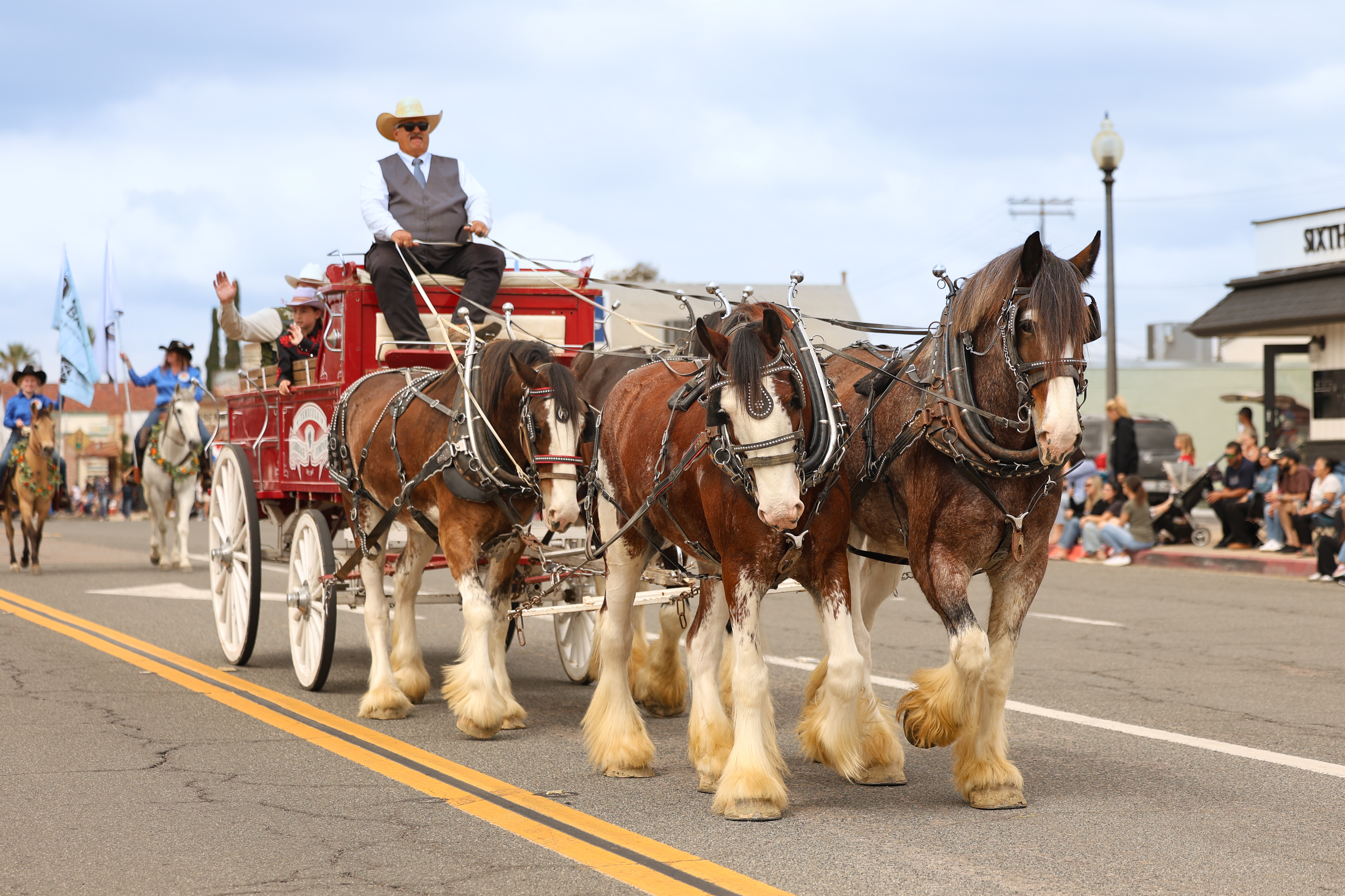 A team of Clydesdale horses from Temecula Carriage Company pulls...