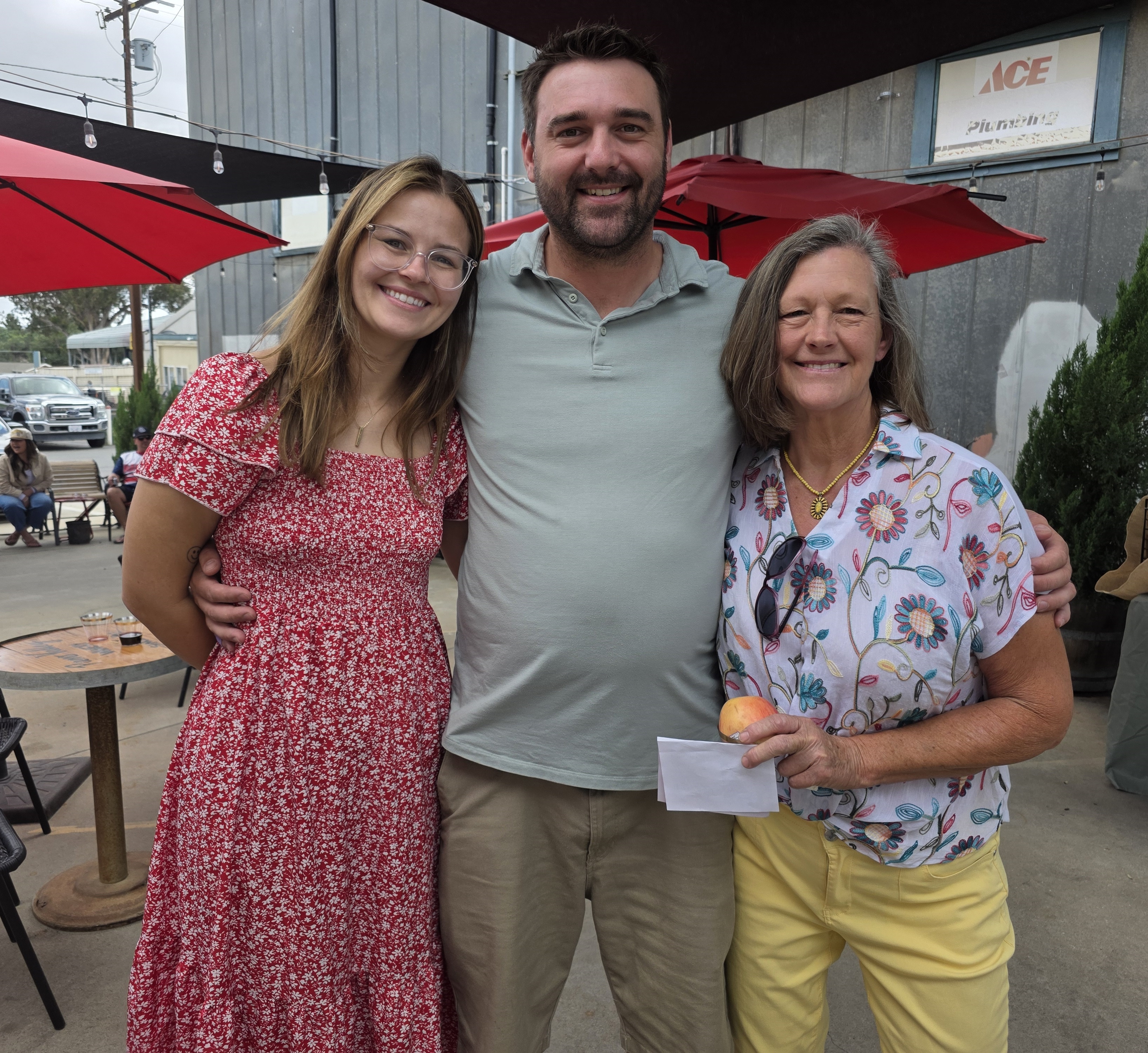 From left, Mackenzie Mahaffey, her fiancé Travis Stevens and mom...