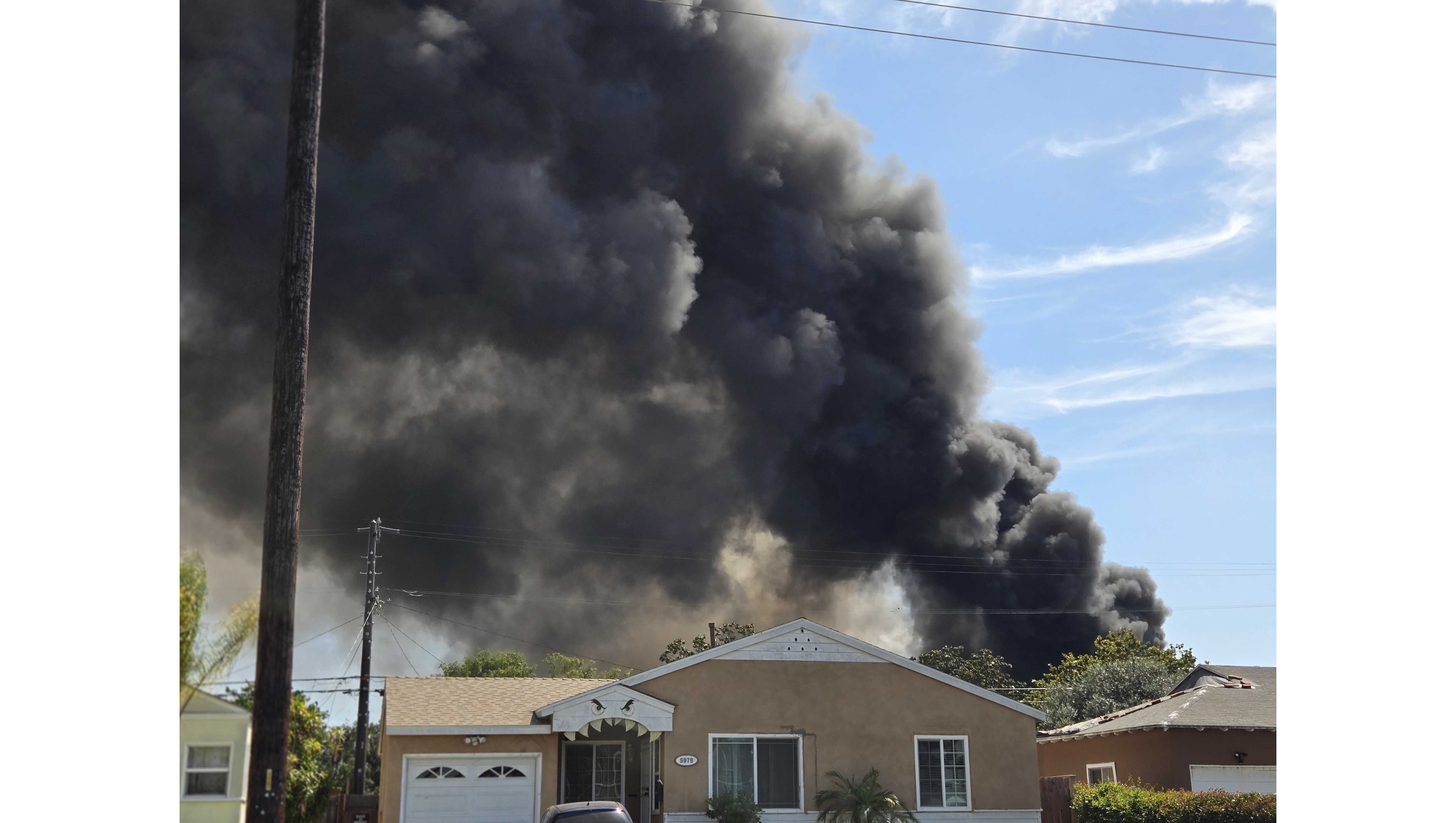 Firefighters battled an industrial building fire Sunday, May 24, in...