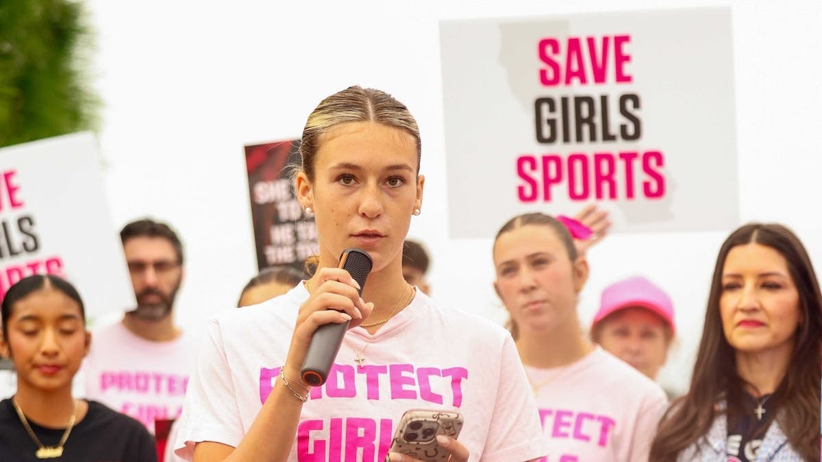 Crean Lutheran High School senior track and field star Reese Hogan speaks at a 'Save Girls Sports' rally.