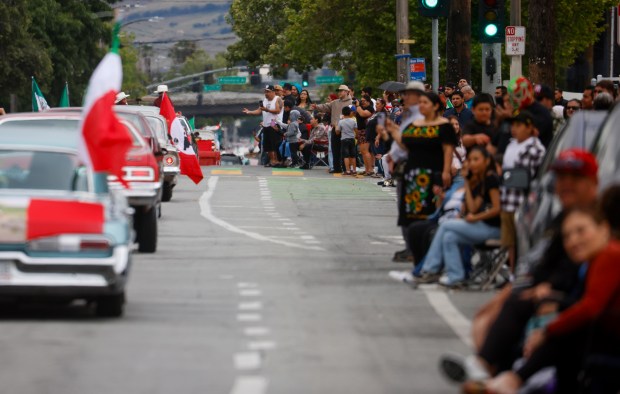 Spectators watch the 3rd Annual San Jose Cinco de Mayo Cultural Parade & Festival as they head south down South King Road in San Jose, Calif., on Sunday, May 3, 2026. (Nhat V. Meyer/Bay Area News Group)