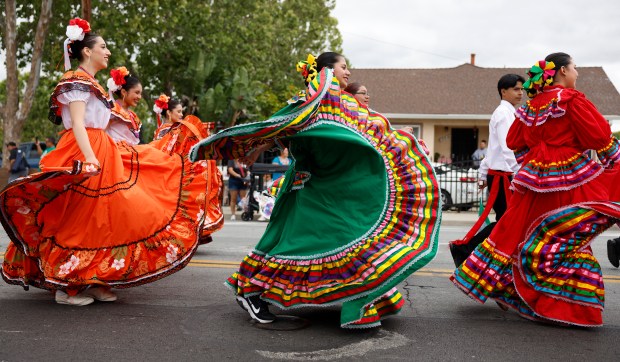 Dancers head south down South King Road in a vintage police car during the 3rd Annual San Jose Cinco de Mayo Cultural Parade & Festival in San Jose, Calif., on Sunday, May 3, 2026. (Nhat V. Meyer/Bay Area News Group)
