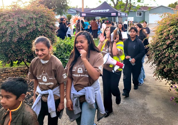 Community organizers and local youth with the Mexican Heritage Plaza, SOMOS Mayfair and the Si Se Puede Collective gather on Thurs., May 28, 2026, in San Jose, Calif., to request that the Alum Rock Union School District Board sign a contract agreeing to work with them to rebuild the former Mexican American Community Service Agency building. The closed building burned down in August 2025, after advocates for years lobbied the city to rehabilitate and reopen it. (Kyle Martin/Bay Area News Group)