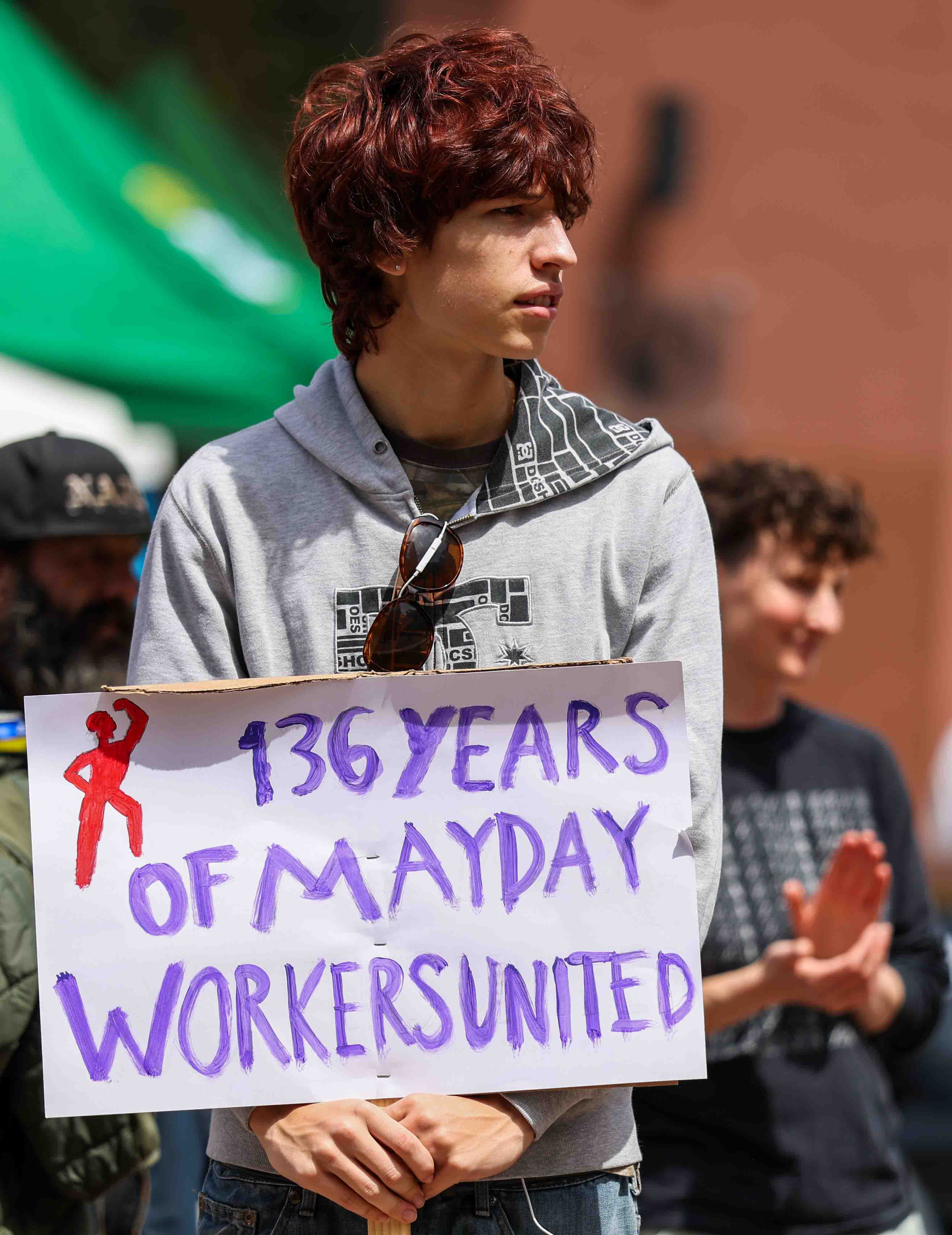 A young demonstrator takes part in a May Day protest...