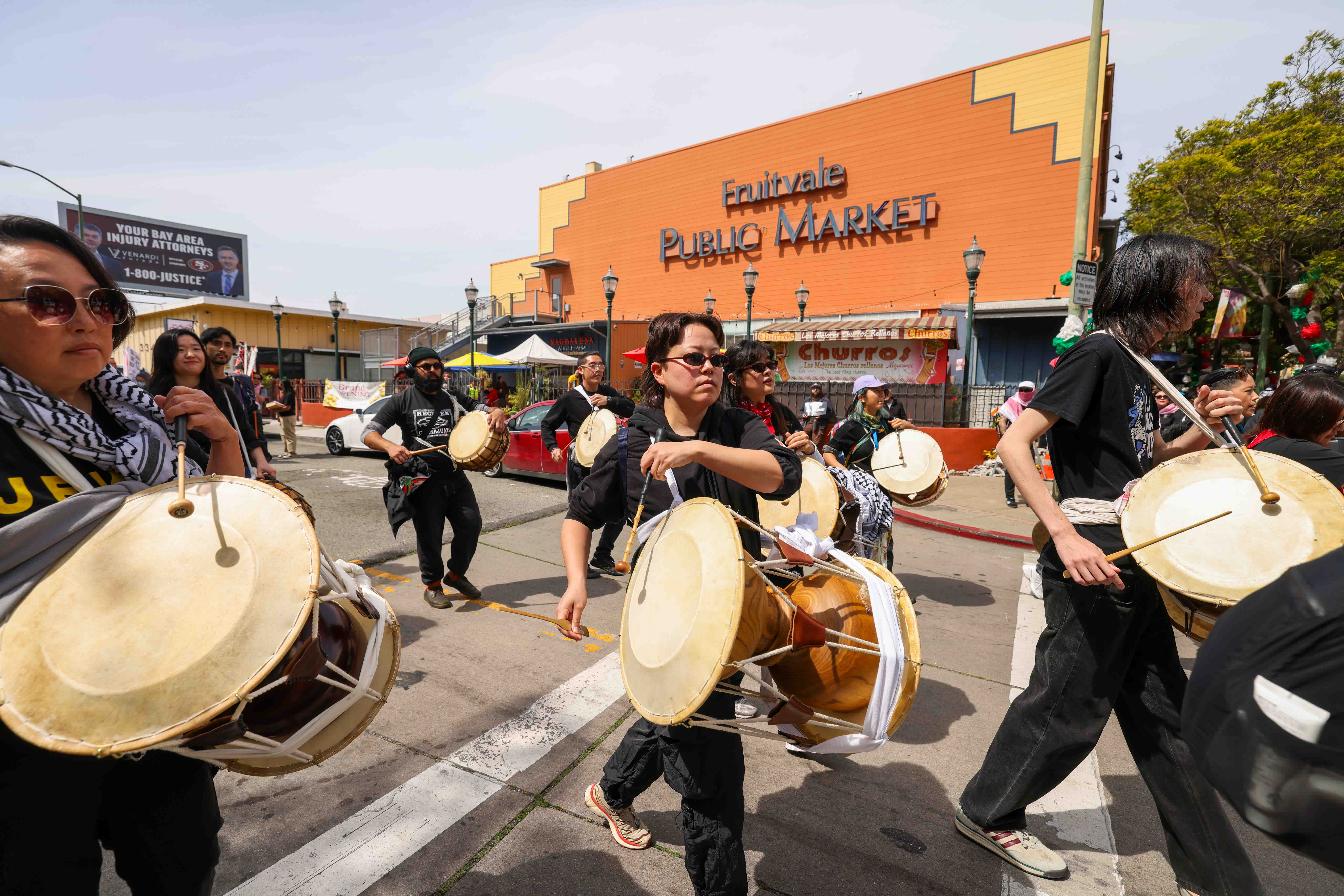 A group of drummers takes part in a May Day...