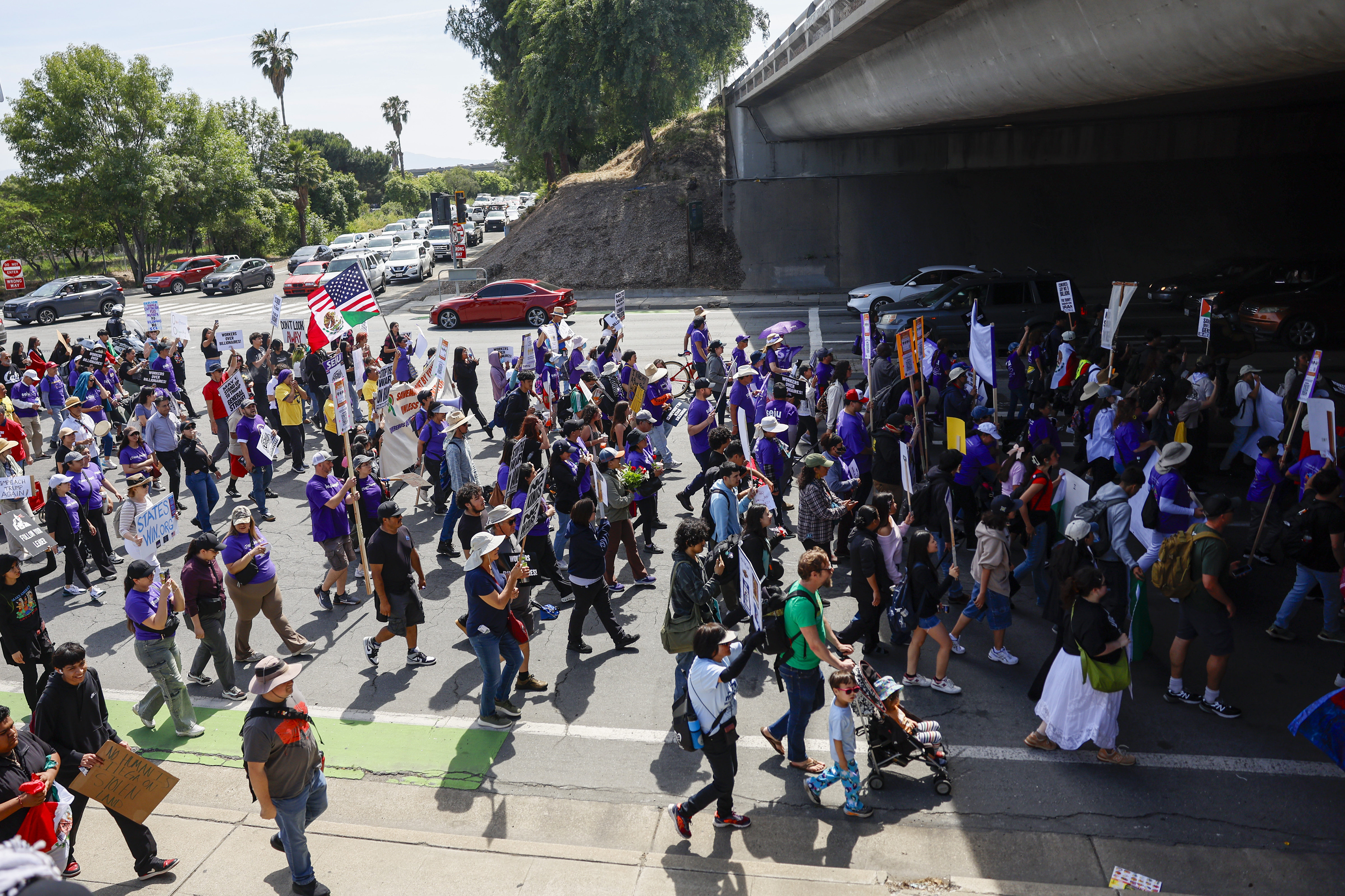 Protesters march during a May Day protest in San Jose,...
