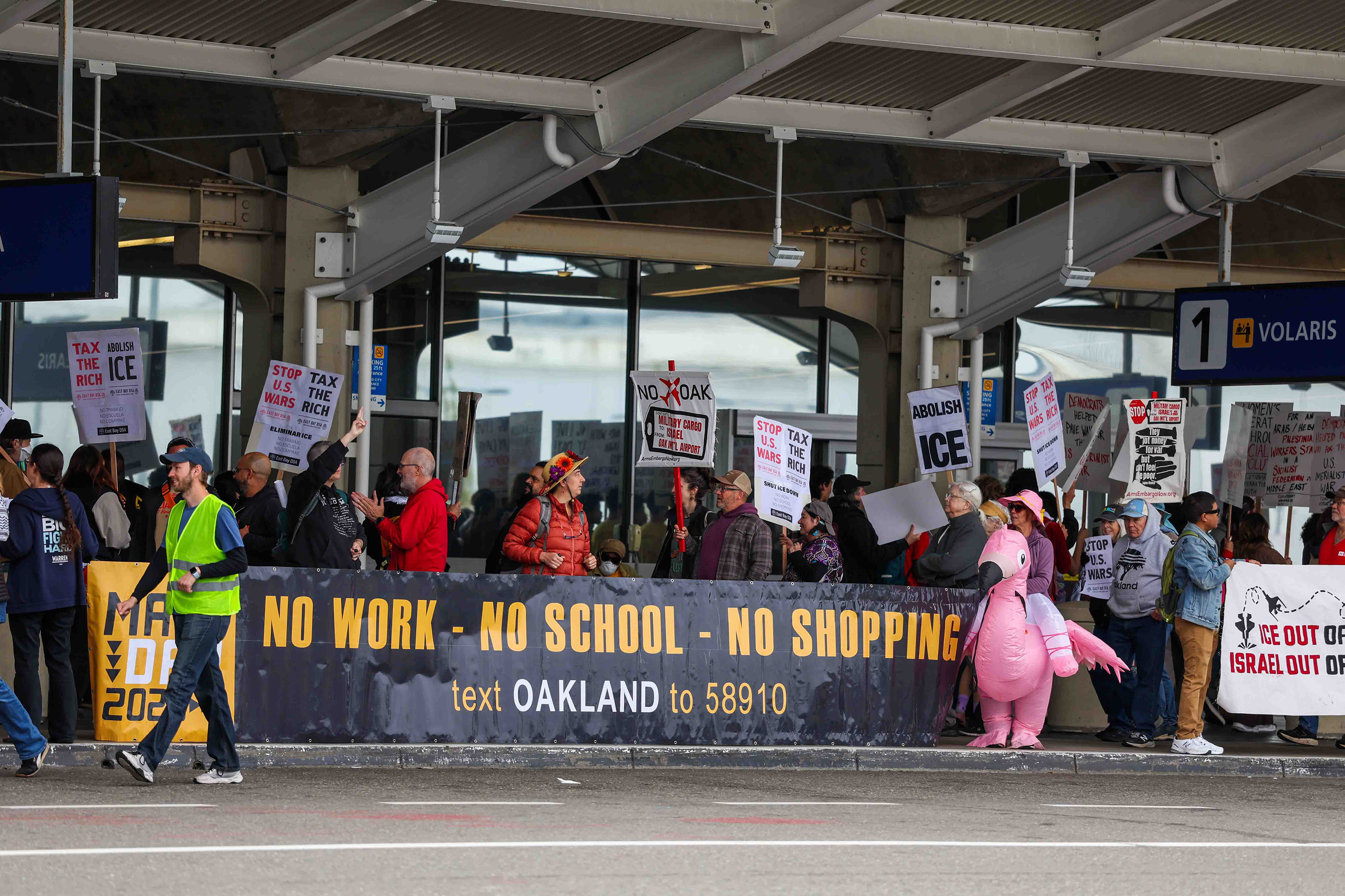 Demonstrators protest at the Oakland International Airport as part of...
