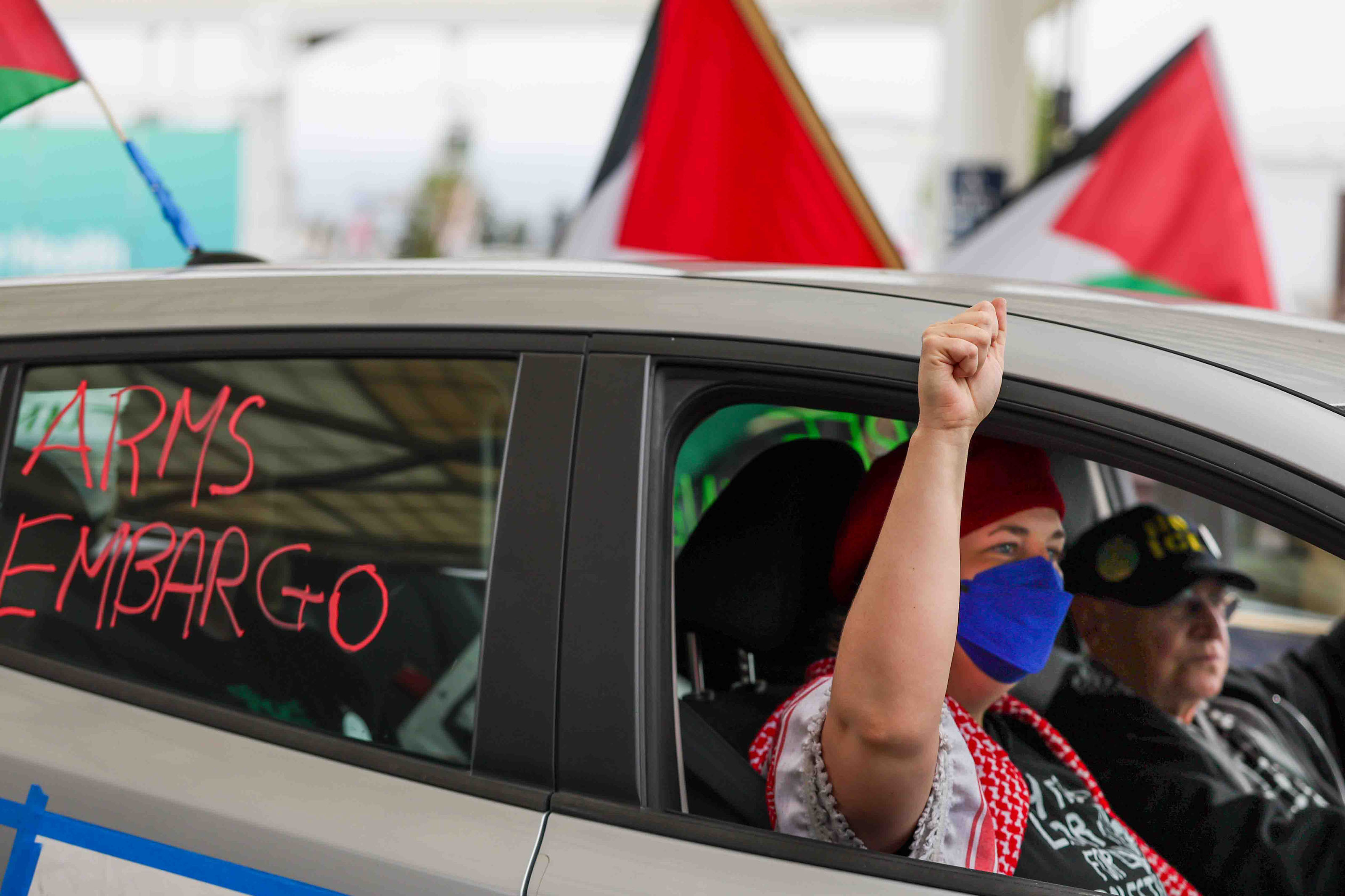 Demonstrators riding in a caravan protest at Oakland International Airport...