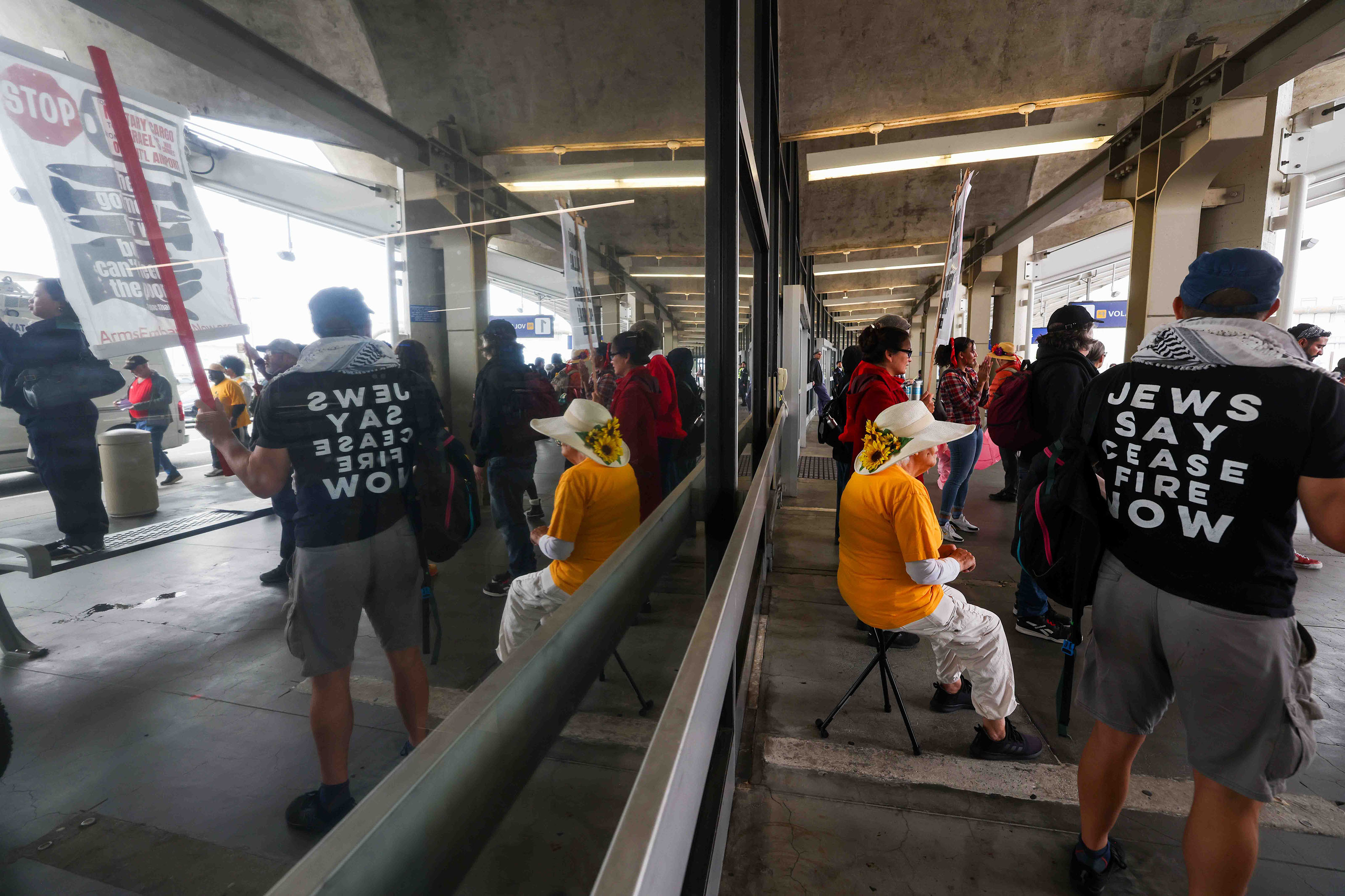 Demonstrators protest at the Oakland International Airport as part of...