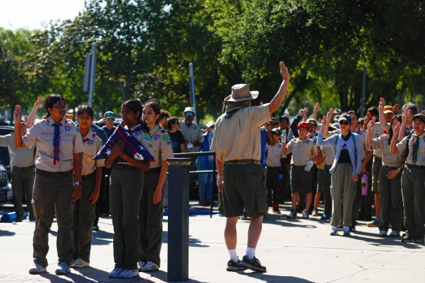 Boy Scouts hold a Flag ceremony before placing flags at the gravesites of people who served in the US Arm Forces at Oak Hill Cemetary in San Jose, Calif., on Saturday, May 23, 2026. (Shae Hammond/Bay Area News Group)