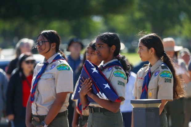Boy Scouts hold a Flag ceremony before placing flags at the gravesites of people who served in the US Arm Forces at Oak Hill Cemetary in San Jose, Calif., on Saturday, May 23, 2026. (Shae Hammond/Bay Area News Group)