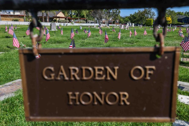 American flags stand in front of the gravestones of fallen soldiers for Memorial Day weekend at Memory Garden Cemetery in Livermore, Calif., Saturday, May 23, 2026. About 120 mother-and-son teams from the Livermore chapter of the Young Men's Service League, in partnership with members of American Legion Post 47, placed the flags during the annual event at Memory Garden Cemetery and St. Michael's Cemetery. (Ray Chavez/Bay Area News Group)