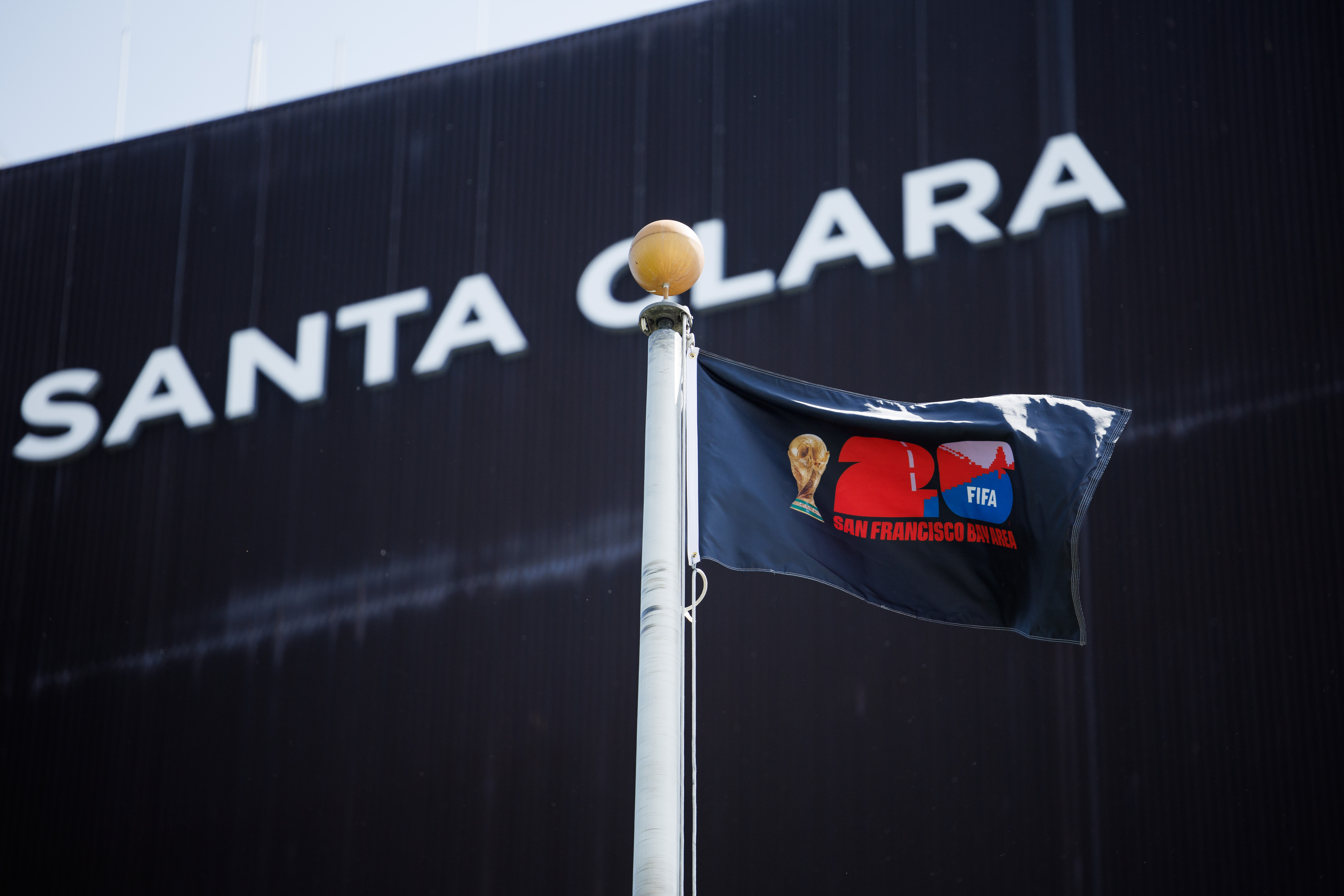 A FIFA World Cup 26 flag waves in the wind...