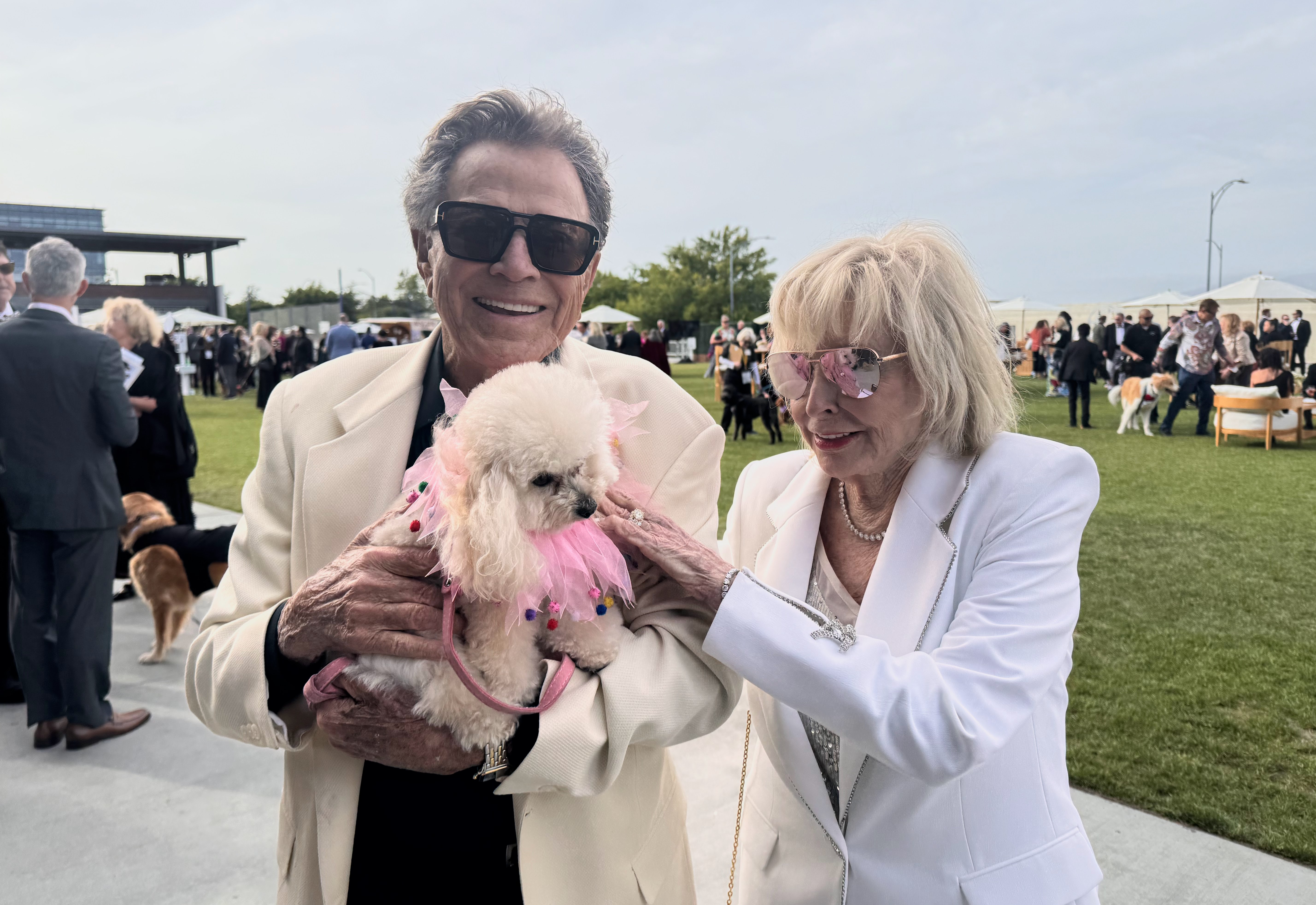Kevan and Anita Del Grande hold their dog, Honey, at...