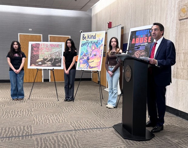 Santa Clara County District Attorney Jeff Rosen congratulates the winners of the 2026 "Justice for All" art contest ceremony at the Santa Clara County Government Center on Friday, May 15, 2026. The winners are, from left, Kimani Rivera, Allison Li and Angelica Liljenstam. (Sal Pizarro/Bay Area News Group)