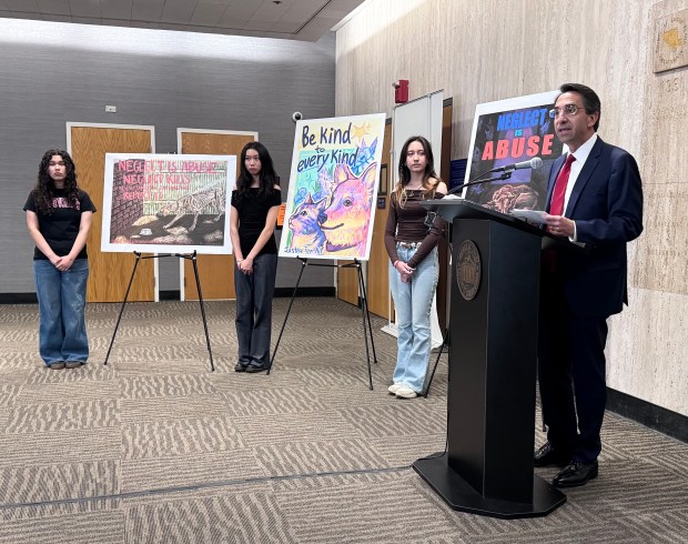 Santa Clara County District Attorney Jeff Rosen congratulates the winners of the 2026 "Justice for All" art contest ceremony at the Santa Clara County Government Center on Friday, May 15, 2026. The winners are, from left, Kimani Rivera, Allison Li and Angelica Liljenstam. (Sal Pizarro/Bay Area News Group)