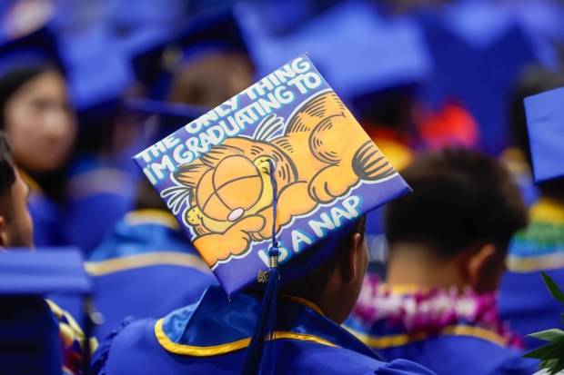 A graduate has a Garfield themed graduation cap during The Lucas College and Graduate School of Business graduation ceremony at SJSU in San Jose, Calif., on Thursday, May 21, 2026. (Shae Hammond/Bay Area News Group)