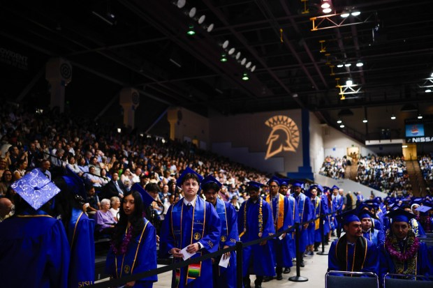 Graduates stand in line during The Lucas College and Graduate School of Business graduation ceremony at SJSU in San Jose, Calif., on Thursday, May 21, 2026. (Shae Hammond/Bay Area News Group)